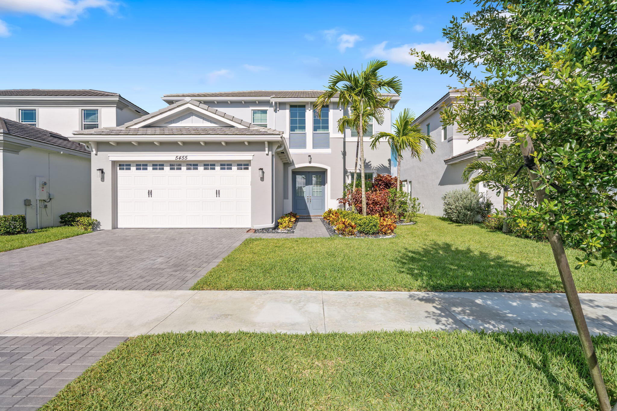 This beautifully upgraded 4-bed, 3.5-bath home in The Orchards at Westlake features rare dual primary suites (upstairs and downstairs), a flexible den, a gourmet kitchen with soft-close cabinetry, gas double oven/stove, and upgraded refrigerator, and an included washer/dryer. Enjoy a fully fenced yard, extended patio with ceiling fan, and storm-impact windows and doors, along with luxury touches like a spa-style primary bath with dual shower heads, a Level 2 EV charger, and an epoxy-coated garage with sink. Located in a golf-cart-friendly community with Adventure Park, a second park underway, a new elementary school in development, and monthly food truck nights, this move-in-ready home blends modern upgrades, thoughtful design, and a vibrant neighborhood atmosphere. Dis closure: Seller is a licensed real estate agent in the state of Florida.