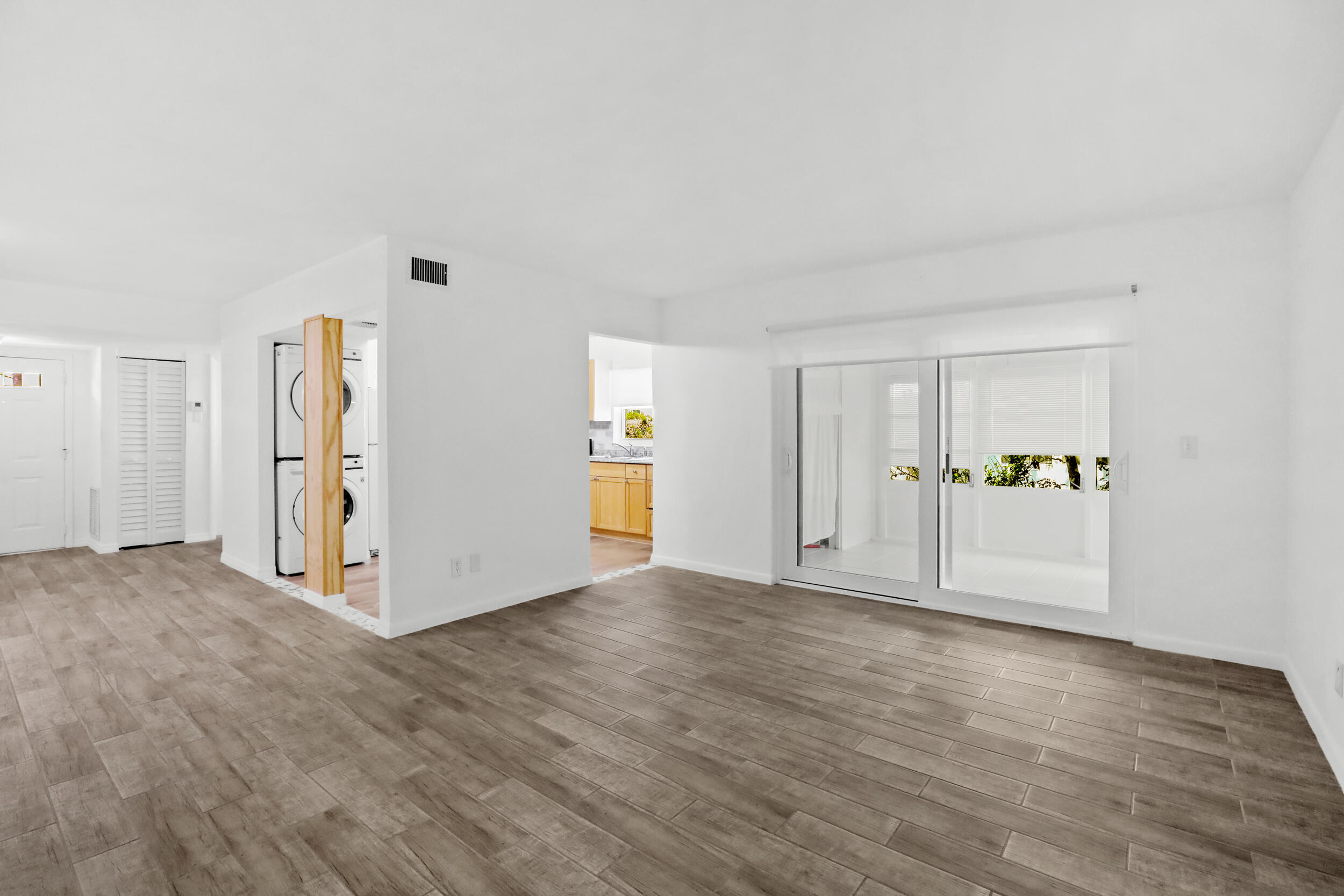 A rare opportunity to own a  Move-in ready, first-floor corner unit. This home has been updated and features an open floor plan, new wood-look tile flooring throughout, new kitchen, smooth-knockdown ceilings, fresh interior white paint, new water heater, new impact sliding glass door, new impact windows in the kitchen and bathrooms. Laundry space inside. Enjoy the enclosed porch plus your own private patio and deck area overlooking the peaceful Savannas Preserve, perfect for relaxing or entertaining outdoors.   Access to the gated community with Twenty four hours guard gate. You will live stress free & have the association to take care of the lawn, water, sewer, internet, cable, roof, and more...assigned parking plus extra guest parking spaces. Residents enjoy amenities including Residents enjoy amenities including tennis court, shuffleboard, swimming pool, clubhouse and a variety of social activities and classes.