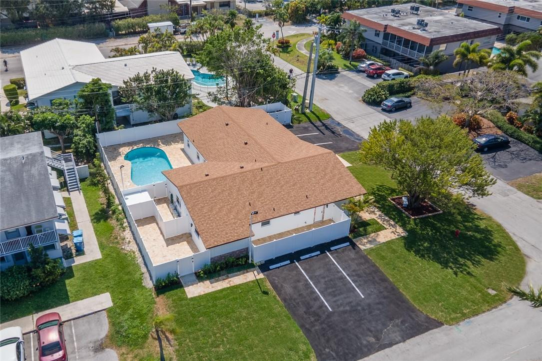 Amazing Two bedroom unit with big private Patio and fantastic Location! 1.5 Miles to the Beach, restaurants, hospitals and much more! Fabulous four-plex apartment with assigned parking, laundry facilities and shared pool. Totally renovated with impact windows, new roof, beautiful white kitchen, stainless steel appliances, quartz counter tops, new baths, freshly painted, new AC split system, new doors, and restored mid century terrazzo flooring. *water and trash included*
