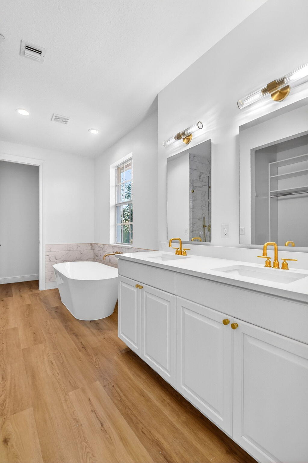 WELCOME TO THE LUXURIOUS, SPACIOUS, MODERN, WELL-KEPT SECRET - COURTYARDS OF LAKE WORTH!   8 MINUTES from the BEACH, DOWNTOWN and JUST a couple exits away from Southern.   Unit 32 is a corner-unit featuring a Personal 2-Car Garage, Beautiful flooring throughout, ''Calacatta'' Quartz Countertops in all Bathrooms and the Kitchen.  New modern lighting/vanities throughout. His and Her Closets in Master with an En-Suite you have to see in- person to appreciate!   All units are professionally managed and have routine larger services, such as HVAC, conducted semi-annually. Come take a look for yourself, schedule your personal, private showing TODAY!