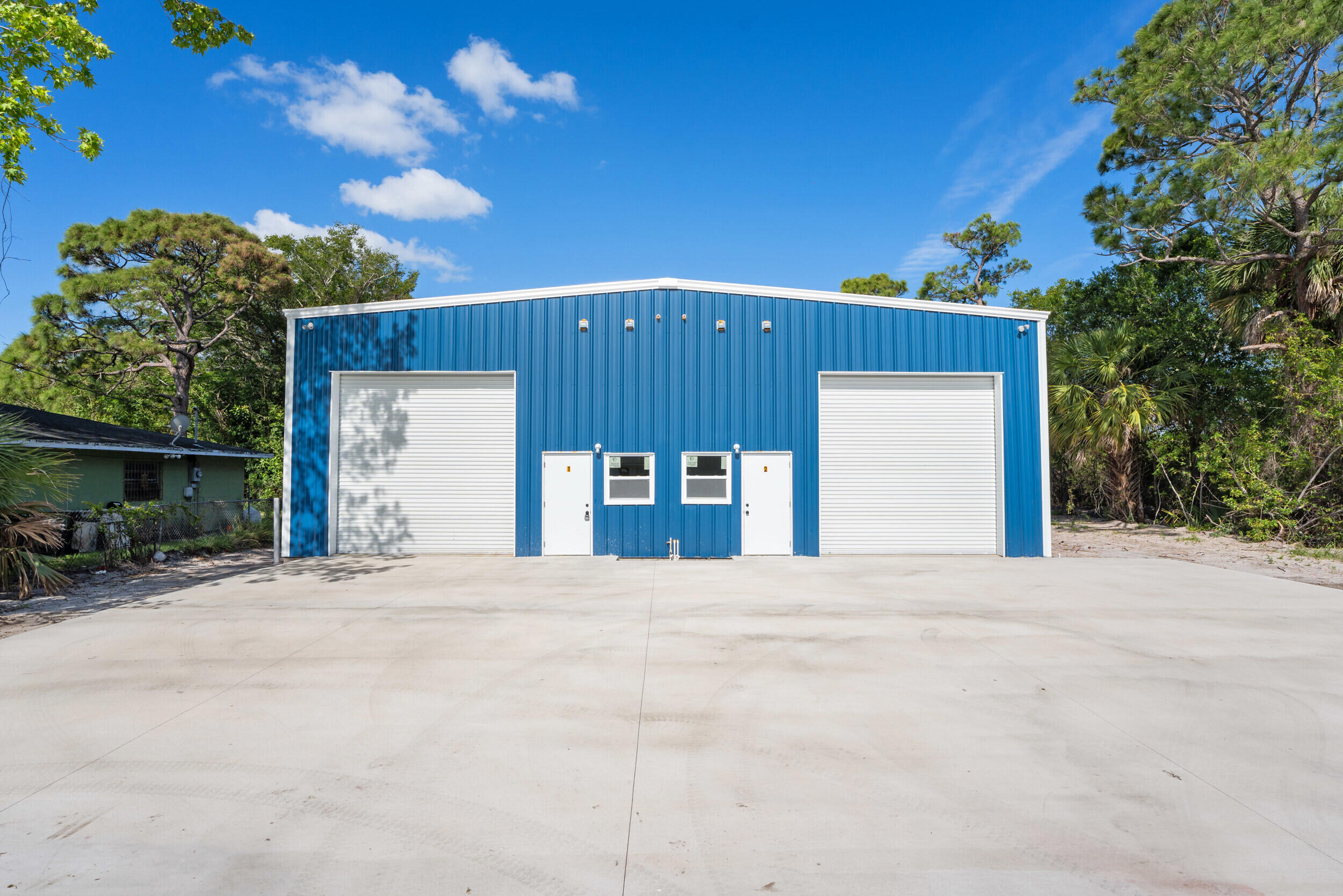 This brand-new 3,000± square foot steel warehouse, slated for delivery in early March 2026, offers a rare owner-user or investor opportunity in Fort Pierce with immediate proximity to Treasure Coast International Airport. The 50' x 60' clear-span layout supports a wide range of service, trade, and light industrial uses and features two 12-foot roll-up doors for efficient loading and vehicle access. The building is equipped with 400 amps of power to accommodate equipment-intensive operations. Situated on an approximately ¼-acre lot, the property includes usable yard space, on-site parking, and efficient circulation. With limited new construction industrial space under 5,000 square feet in the market, this asset presents a compelling own-versus-lease opportunity.