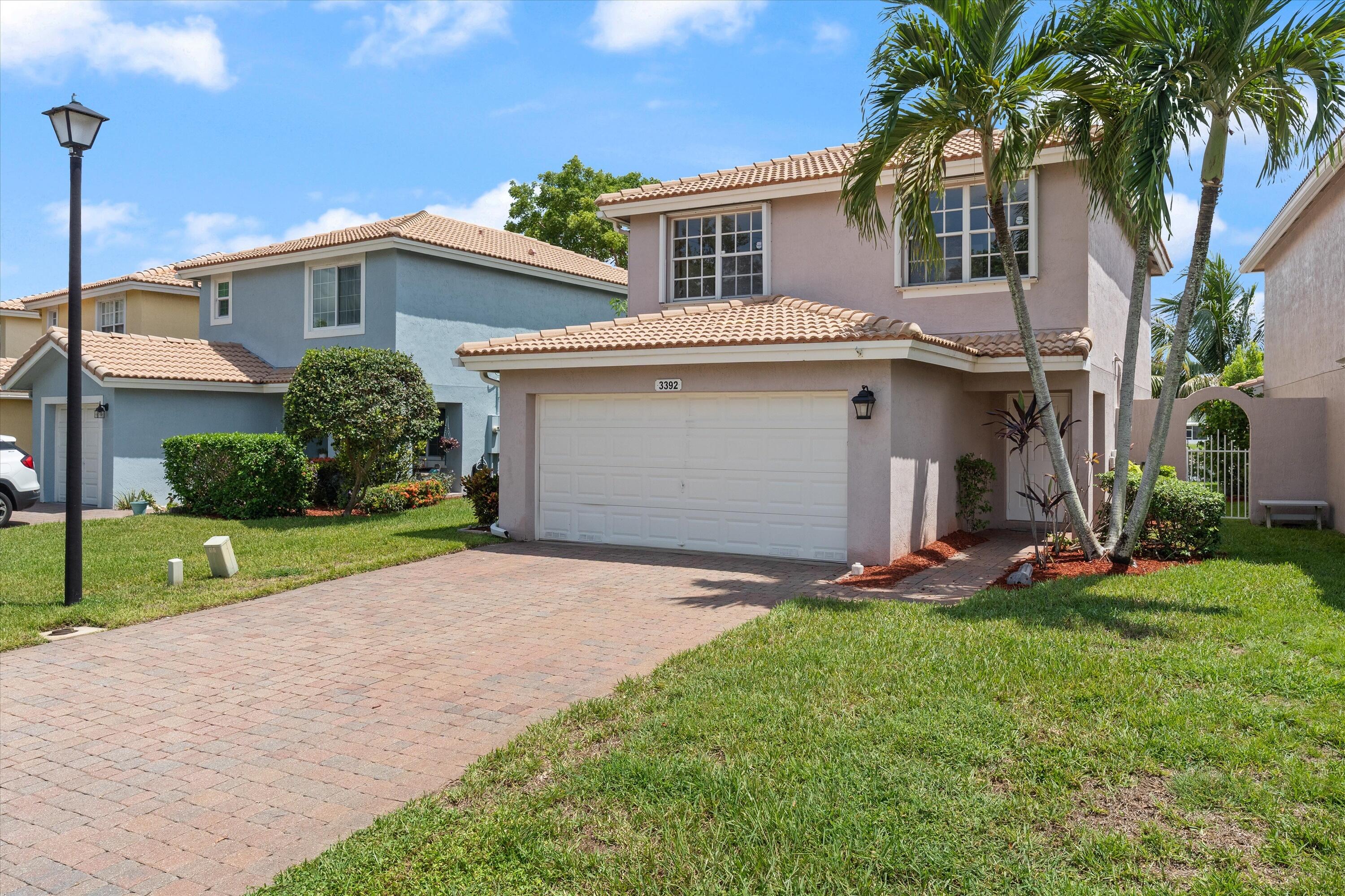Welcome to this move-in-ready 3-bedroom plus loft, 2.5-bath lakefront home in Liberty Bay. Freshly painted, this nearly 1,800-square-foot home offers direct lake views, a two-car garage, a new 2026 Wi-Fi-enabled HVAC system, complete accordion shutters, an owned solar water-heating system, a Wi-Fi-enabled smart irrigation system, and built-in closet organizers. The kitchen features newer black stainless steel appliances, including a side-by-side refrigerator and a large-basin stainless steel sink. The versatile upstairs loft provides flexible space for a home office, playroom, media room, or additional living area. Outside, enjoy a fully fenced waterfront backyard and an updated patio with quick-draining tiles. Community amenities include a pool, clubhouse, fitness center, playground, jogging paths, picnic areas, and sidewalks, with convenient access to shopping and dining.