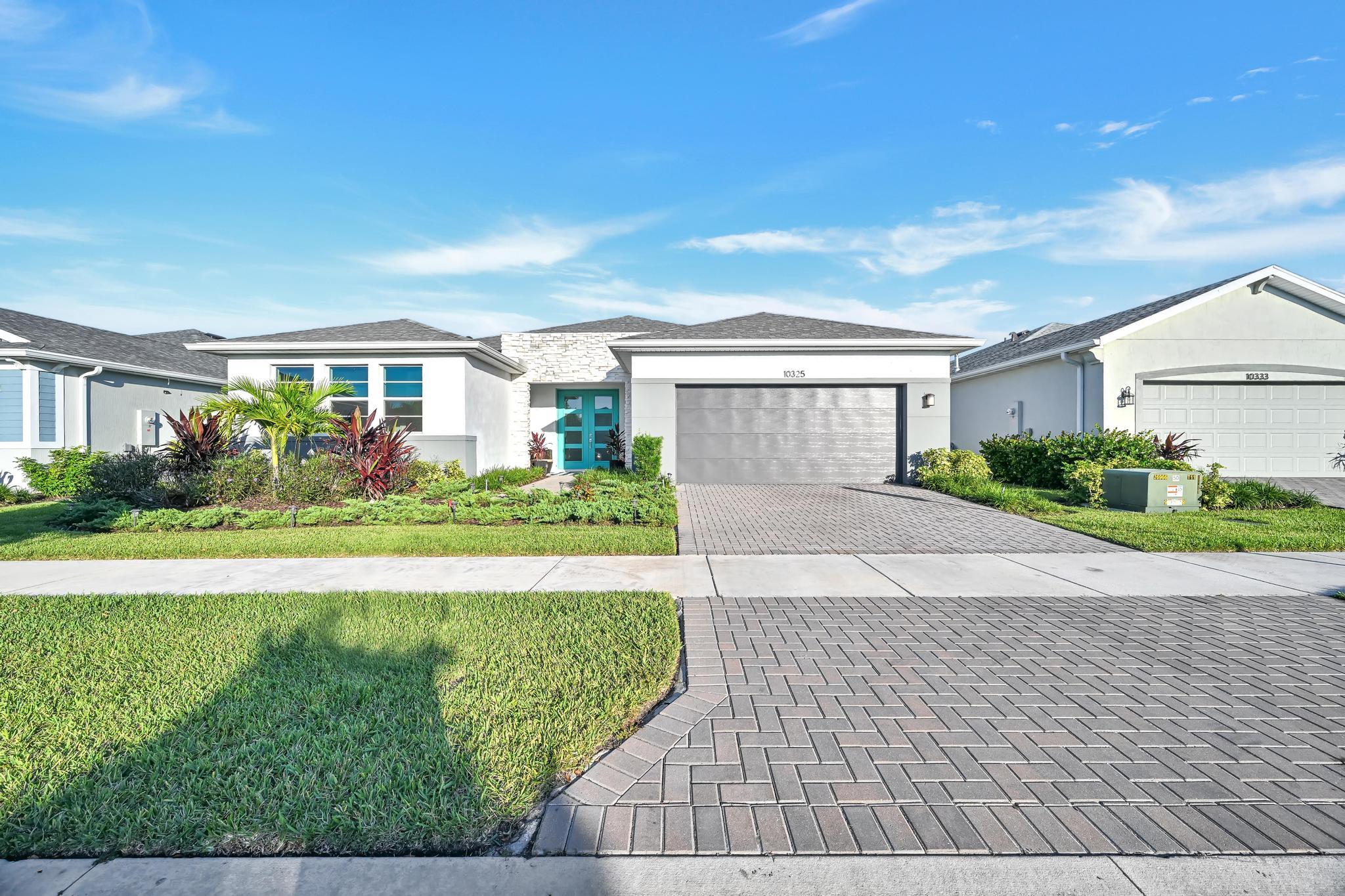 Welcome to this exceptional 4-bedroom, 3-bathroom single-family residence in Cadence. This one-story home offers 2,530 square feet of finished living space, providing comfortable room for all your needs. With a two car garage and a waterfront location, this property combines convenience with the appeal of waterfront living. The thoughtful layout and generous square footage create an inviting atmosphere throughout the home. Situated in the desirable Cadence  community in Tradition, this residence presents an outstanding opportunity to own a waterfront property with ample space and practical amenities.