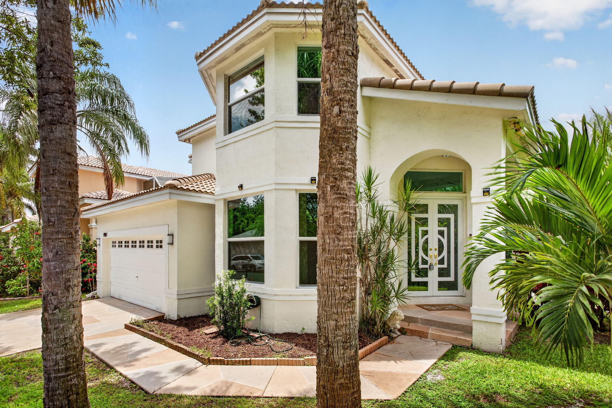 Walking distance to parks, tennis facilities, schools, community amenities, and nearby HOUSES OF WORSHIP! Fully Remodeled, New floors upstairs and downstairs, IMPACT windows , Brand new ROOF, New bathrooms, new kitchen. This Beautiful 5-bedroom, 4-bath, has been fully Remodeled two-story home located on a tranquil corner lot with no neighbor on one side in the desirable Cypress Cay community. Light and bright with soaring ceilings, spacious formal living and dining areas, and an expansive kitchen and family room overlooking a huge domed screened patio ideal for indoor/outdoor living and entertaining. The downstairs primary suite features renovated finishes and custom built-ins for additional storage and functionality. Upstairs offers one bedroom with ensuite bath, two additional generously sized bedrooms connected by a Jack-and-Jill bathroom, plus a versatile loft perfect for an office, media room, reading area, or flex space. Residents of Cypress Cay enjoy access to a community pool, spa, and tennis court, all within a smaller, well-located subdivision in the Parkland school zone.