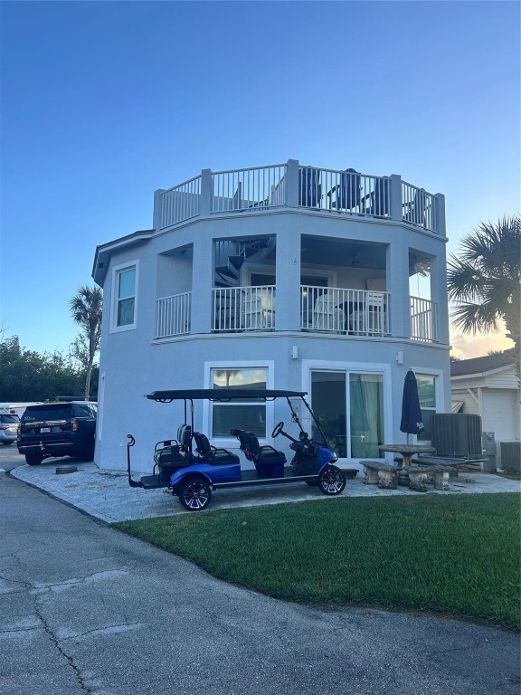 Custom 4 bedroom/2.5 bath home with marina and ocean view rooftop balcony offering stunning sunsets and sunrises for sale in the beautiful Nettles Island in Jensen beach. Built in 2022 with concrete block, metal roof, impact windows and doors that will give peace of mind and lower cost insurance. Corner lot offers extra parking for toys. Custom layout with upstairs king primary bedroom and open kitchen, living, and dining. Under cabinet lighting, stainless appliances and double oven. Downstairs offers 3 bedrooms, laundry room, second bonus living room with a custom bar. Steps from the Atlantic ocean, restaurants, bars, Nettles Island living includes a gym, 2 heated pools, beach access, pickleball, hot tubs, water, cable, internet and so much more. Great to live in year round, or incredible rental opportunity. Showings by appointment only- truly a must see!