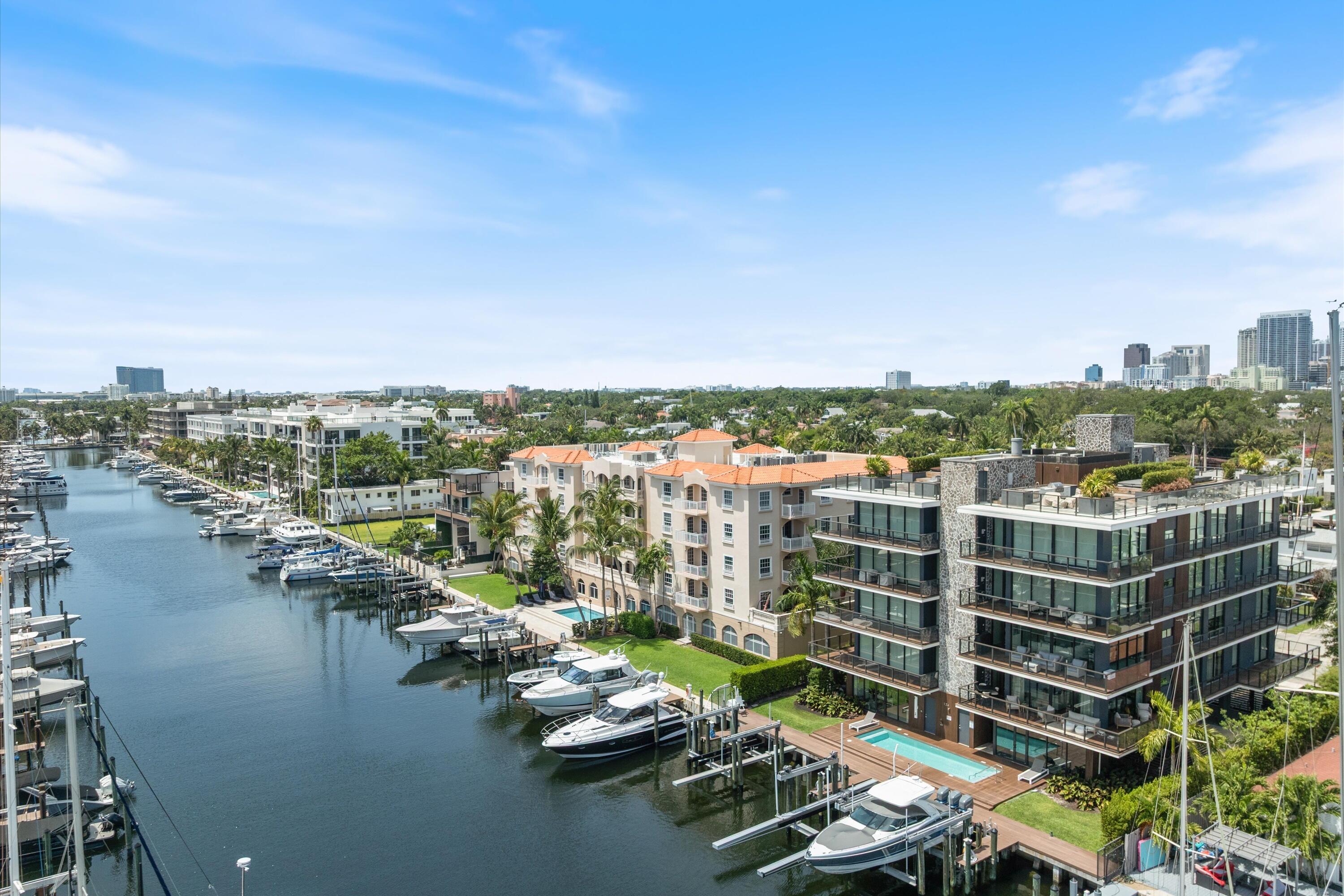 Now you can truly have it all at this impeccably curated full-floor lower penthouse in the prestigious Las Olas Isles—where sophisticated waterfront living meets the vibrant energy of Las Olas Boulevard and the beach beyond. Offering the privacy and comfort of a single-family residence with the ease of boutique condominium living, this extraordinary home presents an unrivaled lifestyle in the heart of one of South Florida's most coveted enclaves. From the private 60-foot yacht dock and rooftop terrace to the serene wide water views from nearly every room, each element has been thoughtfully designed to evoke effortless luxury. Masterfully envisioned with exceptional interiors by acclaimed award-winning designer Shawn Michael Graves, the residence is drenched in natural light and finished with an uncompromising level of craftsmanship. A spectacular custom Eggersmann kitchen serves as the centerpiece of the home, anchored by a dramatic 15-foot by 5-foot island, a 5-burner gas Wolf range, double Sub-Zero refrigeration, and an architecturally striking pivoting wine display wall. Additional bespoke features include custom-designed wardrobes, automated window treatments, and rich herringbone oak flooring throughout. A private elevator foyer opens to expansive living spaces framed by tranquil water vistas and passing sailboats, creating an atmosphere of understated elegance and calm. As evening falls, retreat to the private Brazilian ipe wood rooftop terrace or relax in the oversized jacuzzi while enjoying shimmering downtown skyline views and spectacular sunsets. For the yachting enthusiast, arrival by water is effortless with a private 60-foot dock complemented by a 24,000-pound boat lift—an exceptional offering rarely found in condominium living. This is more than a residence; it is a refined waterfront sanctuary designed for those who expect the exceptional. A truly rare and never-before-available opportunity in one of Fort Lauderdale's most desirable addresses.