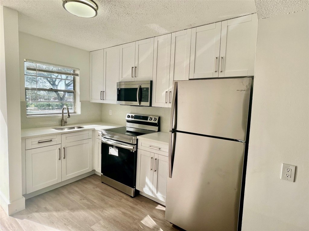Magnificent 2 Bedroom, 1 Bathroom Ground Floor, offering beautiful lake & pool view.Plenty of natural light, New Kitchen, quartz countertops, New stainless steel appliances, New Vinyl flooring throughout, updated bathroom, Central A/C.Walking distance to shopping centers, grocery stores, Easy Access to the Turnpike.Can be rented, A Must See Property. Easy to show.