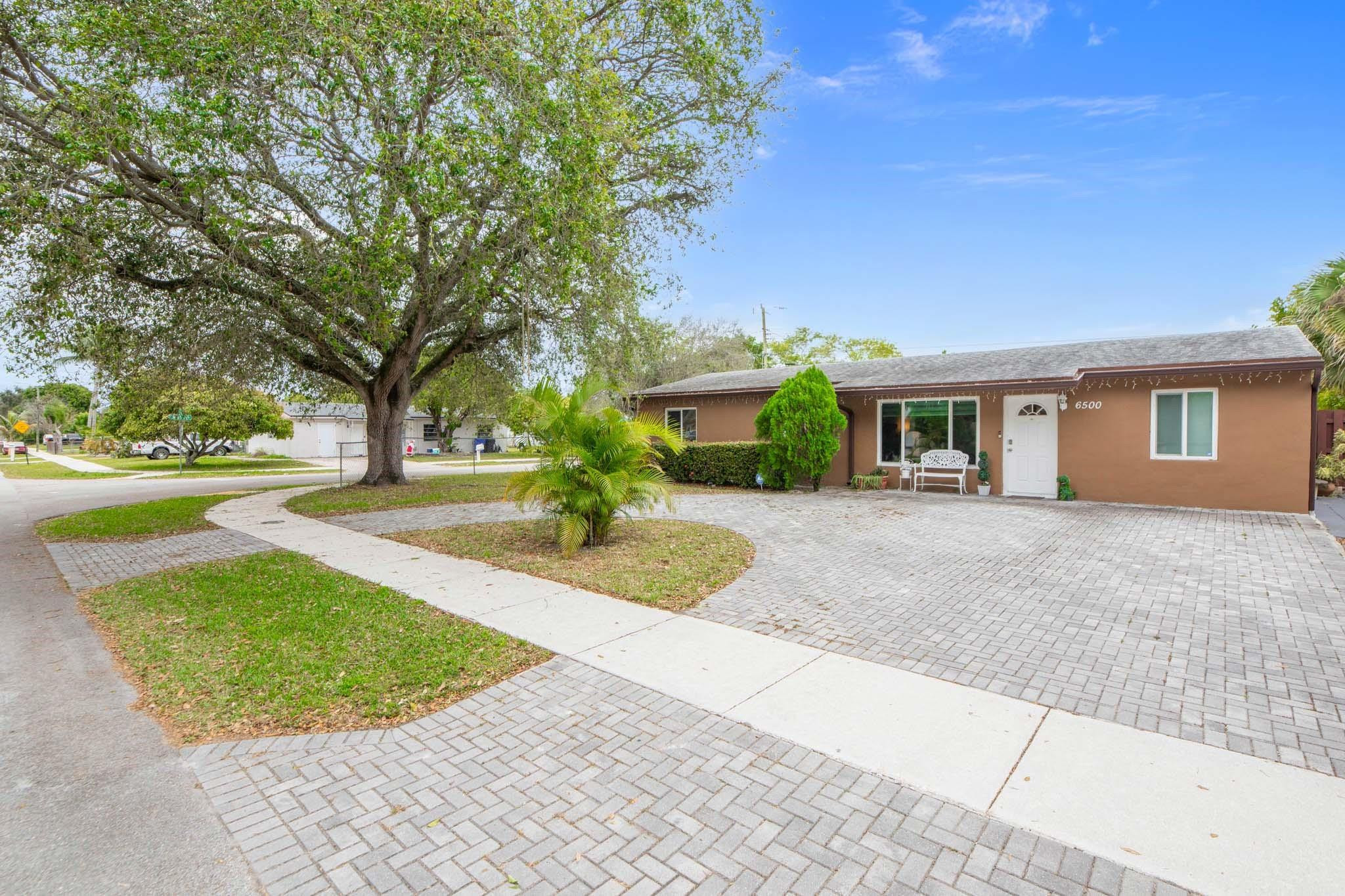 Welcome to this move-in ready Single-Family Home in an ample & desirable corner lot, 7+k sqf. New paver driveway entrance for many cars. Beautiful 1 story, 4 bed & 3 full baths. Open concept, living & dining area in between kitchen w/barstool, wood cabinets, granite counters & stainless-steel appliances. Main suite w/walk-in closet & walk-in shower. Huge, fenced backyard, great for entertainments, BBQ & pool. Deposit, laundry & pantry. FULL EFFICIENCY , guest or in-laws' quarters w/kitchet, bath & bedroom,for extra income. A/C unit 2023, newer water heater & washer/dryer. Hurricane high-impact windows 2017. Roof is well maintained. NO HOA FEES. NO RESTRICTIONS. This North Lauderdale area is near schools, shops, highways and Pompano Beach & Fort Lauderdale. Move-in ready. Call today !