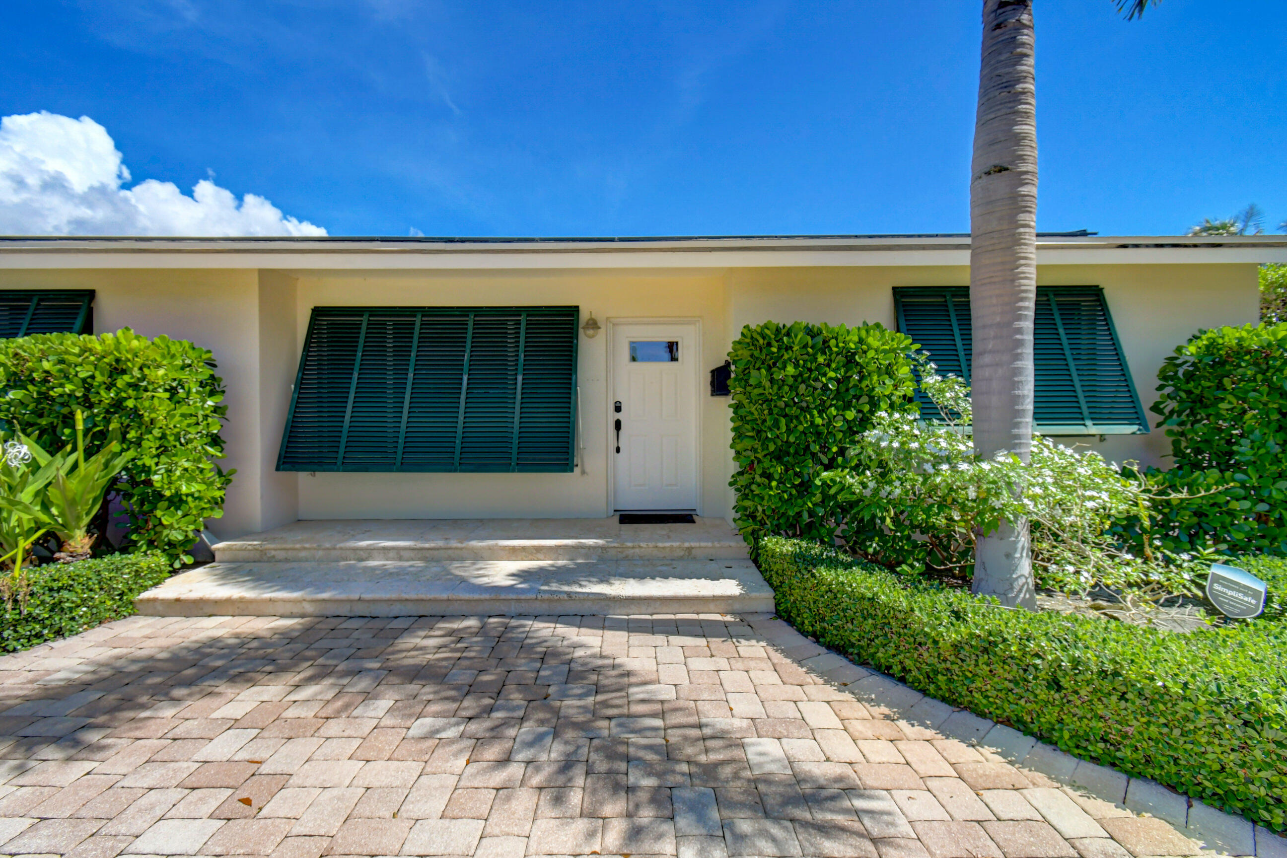 Welcome to this College Park gem. From the moment you step inside, you'll be greeted by an open-concept layout filled with an abundance of natural light. Your eyes are immediately drawn to the wall of windows overlooking the beautifully manicured backyard and private pool, creating a seamless connection between indoor and outdoor living.  Hurricane impact windows were installed in 2021, providing enhanced storm protection, energy efficiency, and peace of mind.  Designed with both entertaining and everyday living in mind, the spacious living area flows effortlessly into the kitchen, featuring a large island, generous prep space, and an inviting breakfast nook. The thoughtfully designed split floor plan offers privacy, with the bedrooms perfectly positioned throughout the home.  The primary suite was recently renovated in 2021 to include an updated en-suite bathroom and walk-in closet.  Outside you're greeted with a crystal-blue pool, lush landscaping, new PVC fence (2025) and plenty of room for lounge chairs, outdoor dining, and even a play area or swing set. This backyard offers the perfect setting to relax, entertain, and enjoy the South Florida lifestyle.  Ideally situated in a convenient central location (no hoa), this home is just minutes from vibrant Downtown Lake Worth Beach, Downtown West Palm Beach, and the world-renowned Palm Beach Island. Enjoy easy access to shopping, dining, entertainment, beautiful beaches, and major commuter routes, with I-95 and Brightline just moments away for seamless travel throughout South Florida.