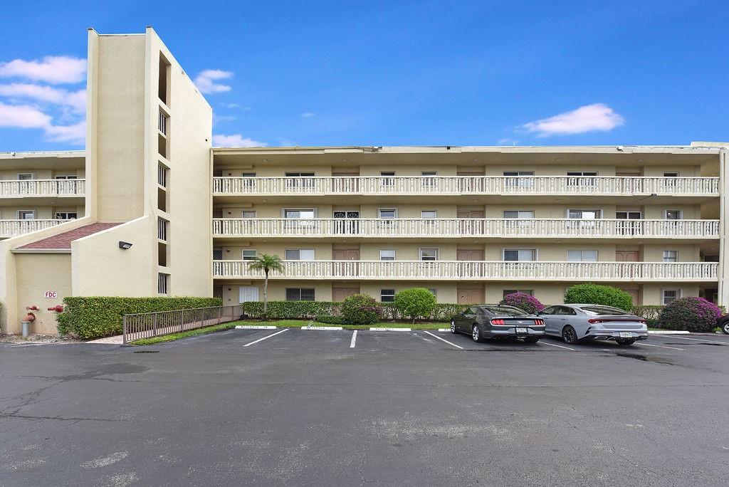Spacious top-floor updated condo in desirable Poinciana community, brand new roof, tile throughout, stainless steel appliances, plenty of cabinet space, custom made closets, built-in desk/office space, contemporary bathroom cabinets, brand new A/C & water heater, washer & dryer in unit, enclosed balcony with beautiful garden view. Building has 2 elevators, community offers 2 pools, clubhouse, gym, tennis, pickleball, onsite restaurant & bar. Located on Poinciana Golf Course, country club lifestyle without mandatory membership dues, near dining, shopping and Florida turnpike. HOA is fully funded, includes internet, cable TV, water