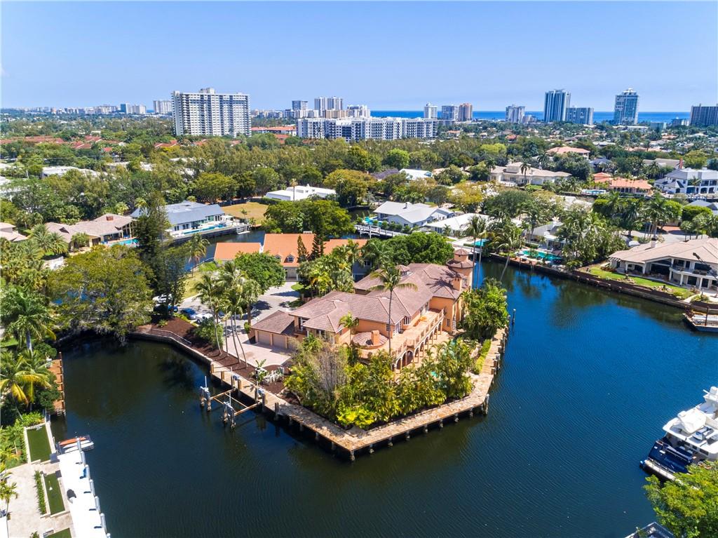 Trophy Point Lot. Nestled on a secluded street of just two homes in exclusive Bay Colony. A developers dream. Amazing opportunity to build your dream home or completely renovate existing Spanish Style structure. Over 450 feet of water-frontage, lagoon style pool, South East exposure .Current structure is comprised of 6 bedrooms 10 baths, approximately 10,868 square feet of living space. Lagoon style pool wraps around the property, waterfalls, grotto, bridge, tropical landscape ground. An ideal setting for outdoor entertainment and Yacht enthusiast. Bay Colony is a private enclave of waterfront homes with 24 hour guard gated security.