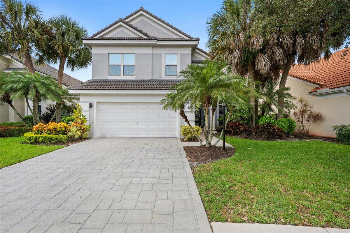 Updated, lakefront home situated on quiet street in boutique, gated neighborhood. First floor master suite with  generous size walk-in closet. The kitchen is beautifully updated with new shaker white cabinets, granite, convection oven/microwave ( double oven ) with warming drawer. Lovely breakfast nook overlooks pool/patio/lake. Family room features high ceilings with open concept in to kitchen area. Powder room/guest bath and laundry room conveniently located downstairs. Three additional bedrooms are located upstairs . This home also has accordion hurricane shutters upstairs/downstairs, fully gated yard and solar outdoor landscape lighting. Sanctuary is a natural gas community and is located in the heart of Palm Beach Gardens!