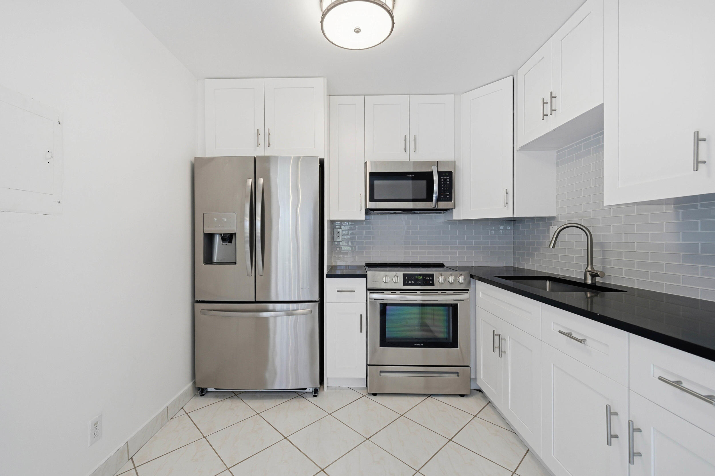 Welcome to 249 Burgundy F, Kings Point Golf & Country Club (55+ Community), a move-in-ready residence offering beautiful golf course views and desirable updates throughout, including an updated kitchen with stainless steel appliances, tile flooring throughout, a primary bedroom with walk-in shower, newer washer and dryer, and a General Electric electrical panel. Enjoy year-round comfort in the enclosed patio with its own A/C unit, along with added peace of mind from accordion shutters. The home is partially furnished, including two TVs, a sofa, and a dining room set, making for an easy transition into the active lifestyle that Kings Point Golf and Country Club is known for, with its extensive amenities and resort-style living in a vibrant 55+ community.