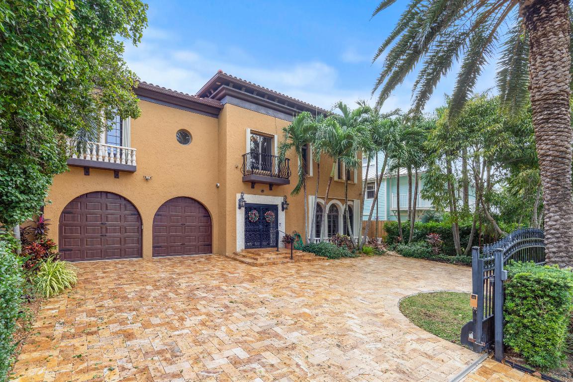 Architectural 3 story Masterpiece where the beach meets the sophistication of Tuscan design all just steps from the ocean in the highly sought after street of Vista Del Mar Dr walking distance to world-class dining, unique shops & an electric nightlife.   
From the inviting warmth of Brazilian cherry floors to the finely crafted, classically styled millwork, every detail of this residence exudes sophistication & charm. Step inside to discover an open floor plan that effortlessly flows from one area to the next, creating an ideal space for both relaxation & entertainment. This beautifully landscaped property offers the epitome of gracious living, with five bedrooms, walk in closets, four full baths, & 1/2 bath spread with an in home ELEVATOR for ease& NEW ROOF & newer(2022-2024) 4 AC UNIT NEW ROOF- 2 YEARS OLD WITH 20 YEAR WARRANTY, NEW AIR CONDITIONING UNITS- 3  IN 2022 & 1 IN 2024  WITH 10 YEAR WARRANTYS
APPLIANCES ARE 15 YRS OLD
MULTI - ZONED
INTERCOM SPEAKER SYSTEM
ADT SECURITY SYSTEM
IN HOME ELEVATOR
