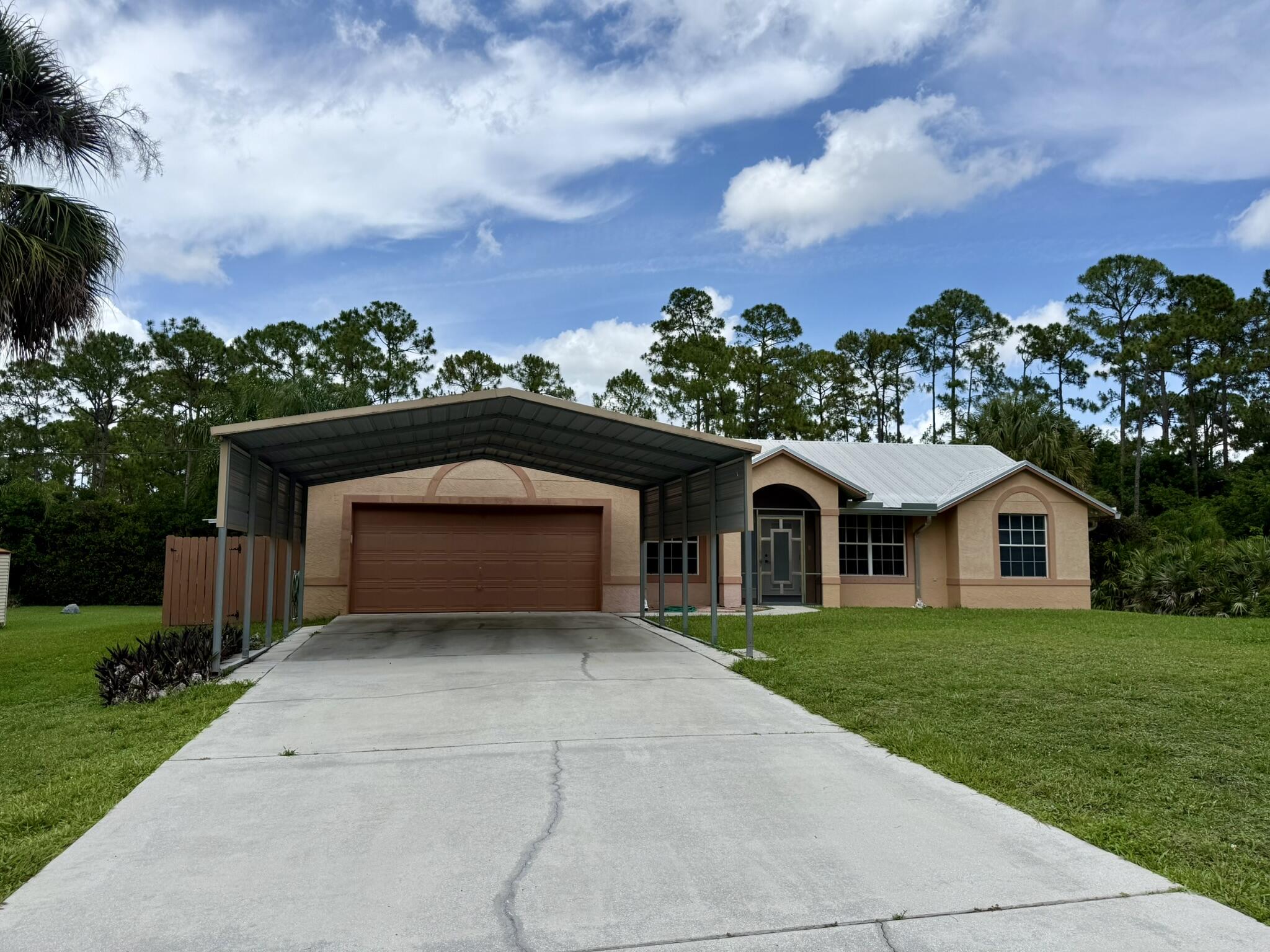 Priced to sell, this lovely 3/2/2 with 1.15 acre lot is ready for you to move in. Can easily enclose the 600' patio to increase sq. ft. under AC and significantly enlarge the house. 18' tile laid on diagonal, bay windows, hurricane garage doors, garage awning to withstand 150 MPH winds, whole-house water filtration. Check out my amazing private wholesale financing with starting rates as low as 3.5% for qualified buyers. Best payment guaranteed with as little as ZERO down.