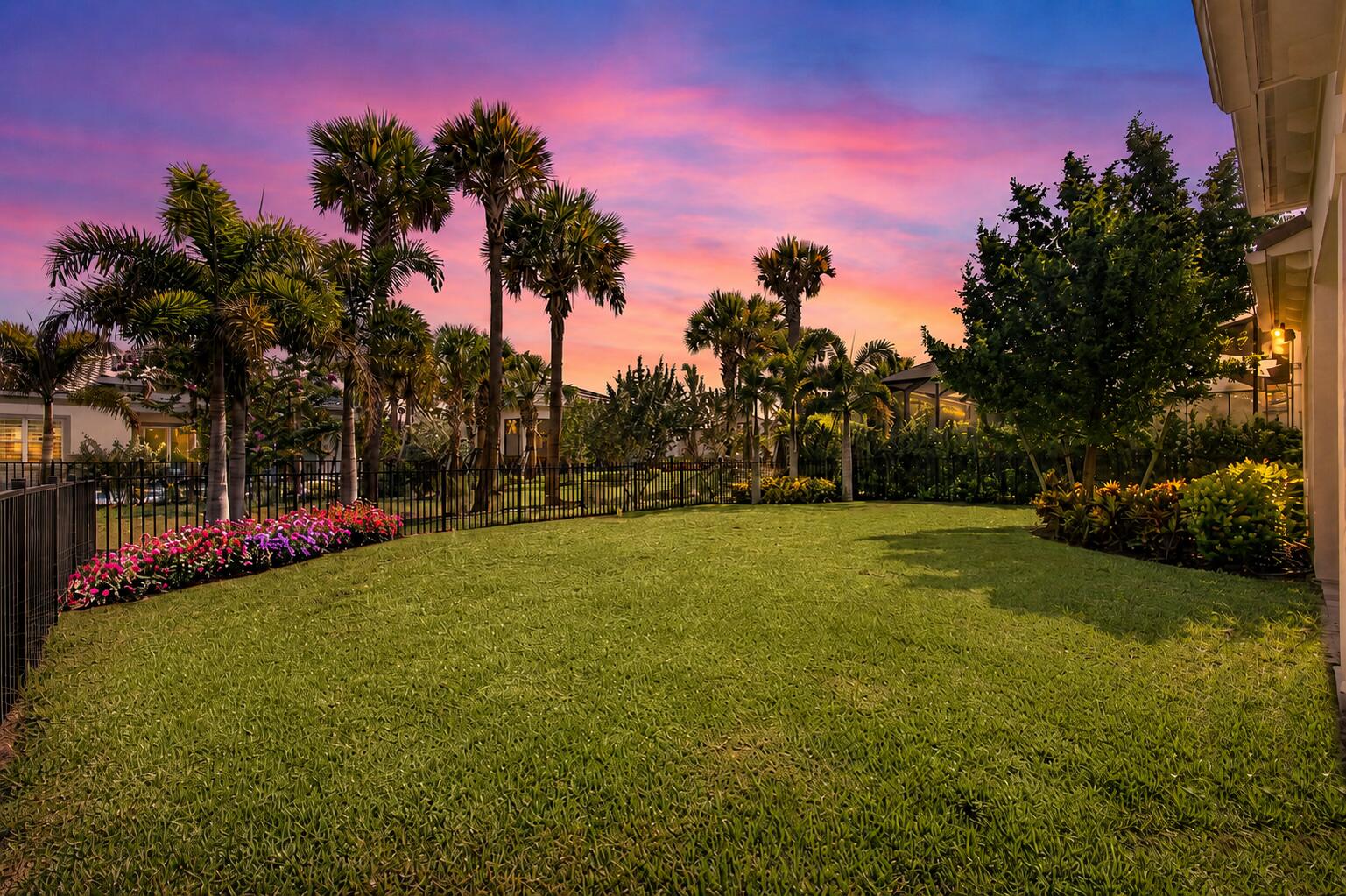Avondale at Avenir is one of Palm Beach Gardens' most sought-after gated, new communities. This pristine home offers a seamless blend of elegance, comfort, and modern luxury with thoughtfully designed single-level living. Featuring 3 bedrooms, 2.5 baths, and approximately 2,100 sq. ft. of living space, this residence offers a desirable split-bedroom floor plan with bright open-concept living, expansive ceilings, abundant natural light, and refined finishes throughout. The spacious kitchen is ideal for both everyday living and entertaining, complete with quartz countertops, a large center island, gas stove, spacious walk-in pantry, and an effortless connection to the main living and dining areas. The gracious owner's suite offers a private retreat with two large walk-in closets and a beautifully appointed bath, designer light fixtures, custom window treatments, carefully selected finishes, and wood-like tile flooring throughout. Enjoy South Florida living from the oversized covered lanai overlooking a private, expansive yard. The outdoor space is ideal for relaxing, entertaining, or simply enjoying added privacy.  Experience private, resort-style living at its finest at Avondale in the Avenir community. Located in sought-after Palm Beach Gardens, this community blends contemporary home designs with exceptional amenities, all set in a relaxed and inviting atmosphere. Residents enjoy exclusive access to the community's private clubhouse, offering an on-site activities director, a wide array of special activities, and events. Amenities include a picturesque resort-style pool, spa, pickleball, tennis, fitness centers, large event room, indoor/outdoor lounge, outdoor playground, game area, and much more. Avenir offers access to miles of walking and biking trails, and a soon-to-be completed vibrant town center with shops and restaurants. Conveniently located near Sandhill Crane Golf Club, an 18-hole championship course, the new Nest Par 3 Course, and various dining options. Across the street is PGA National's Estate Course, with membership options available. Minutes away from shopping, dining, the airport, Palm Beach, and so much more.