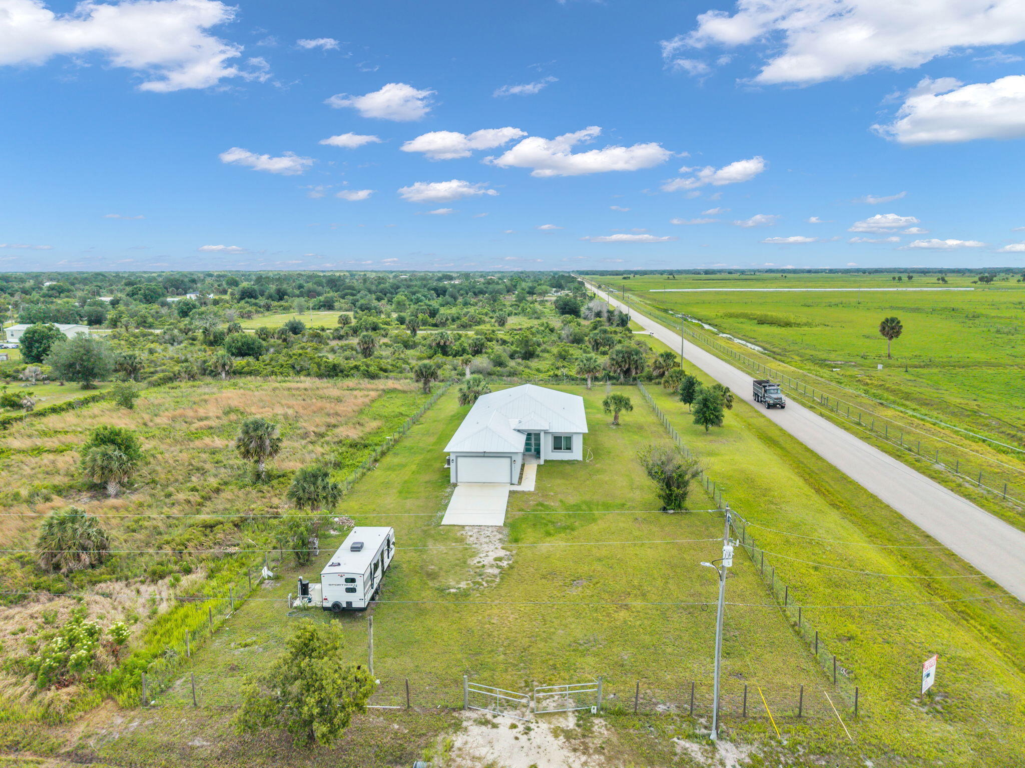 Brand-new 2025 CBS construction on 1.25 acres! This 4BR/2.5BA home offers 2,113 sq ft under air and 2,923 TLA with a modern split floor plan and upscale finishes throughout. Features include wood-look Laminate flooring, tray ceilings, recessed lighting, and an open-concept living area with oversized sliders leading to the covered patio. The kitchen boasts granite countertops, shaker cabinets, stainless steel appliances, and a large island perfect for entertaining. Spacious primary suite features dual walk-in closets, dual vanities, soaking tub, and tiled walk-in shower. Indoor laundry room, oversized covered patio, and 2-car garage complete this beautifully designed home with room for a pool, workshop, RVs, or boats.