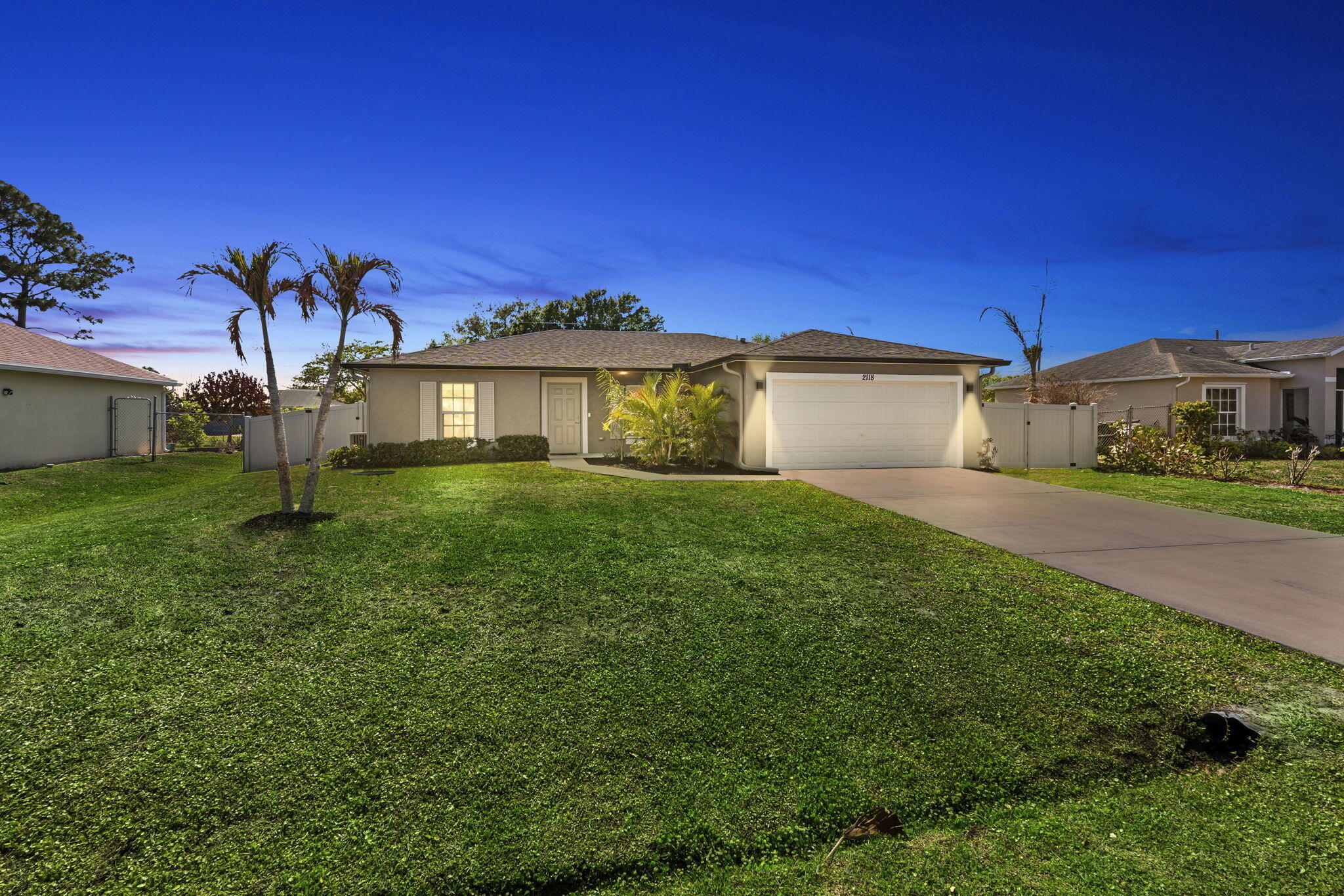 Location! Location! Discover this beautifully maintained 2022 New Construction CBS-Built Home 3 Bedroom, 2 Bathroom, 2 Car Garage Home, located in east Port Saint Lucie, tucked away in a quiet neighborhood, just minutes from Martin County! This Home has it ALL and No HOA! Step inside this inviting Open split-floor plan layout with Vaulted ceilings and Tile flooring throughout the main Living areas. Sliding Glass Doors leading out to your outdoor Oasis (room for Pool) and Huge Fenced in Yard, as you enjoy your morning Coffee or afternoon Cocktail. A Great Home for entertaining with Family and Friends.  The Kitchen is well-equipped with Quartz Countertops, S/S Appliances, Wood Cabinets, Tile Backsplash, under-Cabinet Lighting, a Pantry, and a separate Dining Area, providing both functionality and style. The Owners Suite is very spacious and features a Walk-in Closet with Custom Built-ins, Vanity with Quartz CT and separate Shower, while overlooking your Fenced in backyard! Extensive Upgrades ALL completed in 2023. Smart Home features through an App. New PVC Fence with Double Gate, Extended Concrete Pad for your Boat or RV parking, Storage Shed, New Gutters. ALL New Lighting, Fixtures/Fans, Custom Vanity Mirrors in BOTH Bathrooms, and Built-in Closets and much more! Additional highlights include a 50-amp and Generator Hookup, Surround Sound system in the Living areas, and Solar Panels for energy efficiency. This Home is Move-in ready with modern finishes and upgrades! This Home offers Comfort, Functionality, and a in a Prime Location. Just minutes from Local Beaches, Parks, Downtown Jensen/Stuart, endless shoppes/restaurants, A+ rated schools and much more! Paradise Awaits, don't miss your opportunity on this stunning Home!