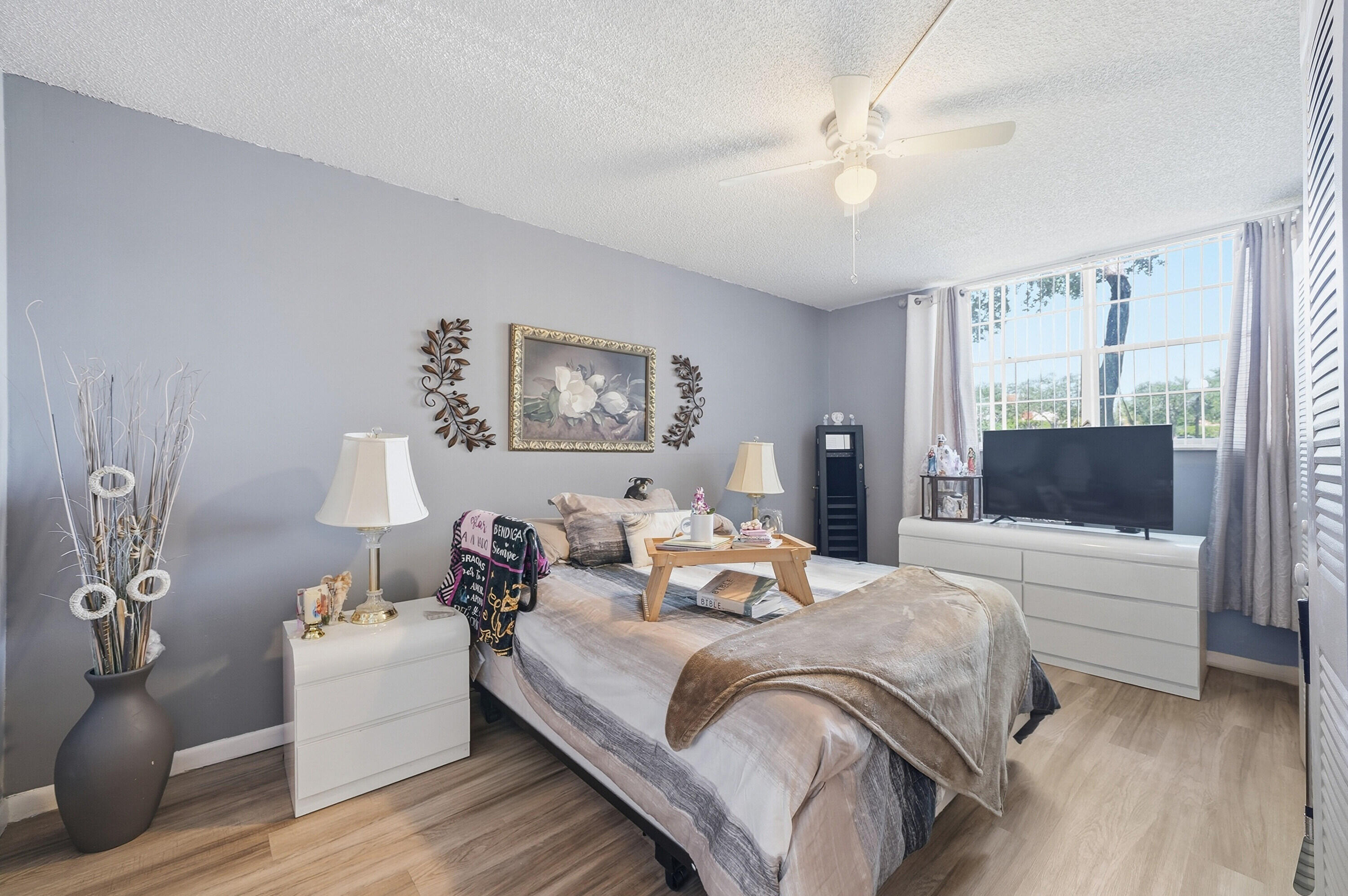 Inviting 1-bedroom, 1.5-bath first-floor condo in the desirable Holiday Springs community. This charming unit features a spacious layout with plenty of natural light and newer flooring throughout. The kitchen has been refreshed with the removal of the original drop ceiling, creating a more open feel. The large primary bedroom includes ample closet space and an en-suite bath, while the additional half bath adds convenience for guests. Enjoy easy ground-floor access and relax in your enclosed patio, perfect for additional living space, a home office, or a cozy sitting area. Holiday Springs offers resort-style amenities including a clubhouse, pool, fitness center, and more. Conveniently located near shopping, dining, and major roadways. Perfect for year-round living or a seasonal retreat. 55+ community. No rentals permitted. 24-hour notice required for all showings. Please use ShowingTime.  Please submit all offers with proof of funds or pre-approval letter. Association requirements include a minimum 20% down payment, 650+ credit score, and six months of association fees to be held in escrow for 18 months. Buyer to verify all association requirements, restrictions, and approval process.