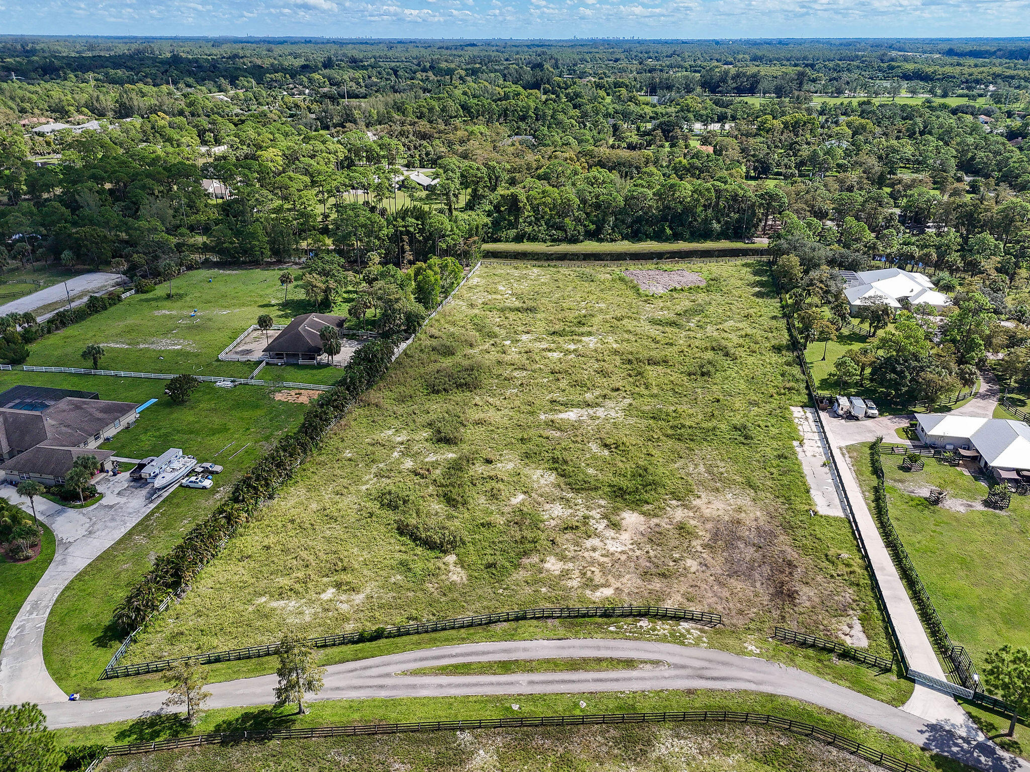 Discover over 5+ acres of pristine land in the highly sought-after Fox Trail community in Loxahatchee. This beautiful equestrian neighborhood is known for its peaceful setting, miles and miles of luxurious bridle paths, and easy access to all of Wellington's world-class equestrian venues—without the Wellington price tag.

This parcel has already been fully cleared and is completely fenced, offering a prime canvas to design and build your dream farm, luxury residence, or private equestrian retreat. Enjoy the privacy, wide open space, and riding lifestyle that Fox Trail is known for, all while being just minutes from showgrounds, shopping, dining, and airports.

A rare opportunity to secure acreage in a premier equestrian location—create the vision you've always imagined.