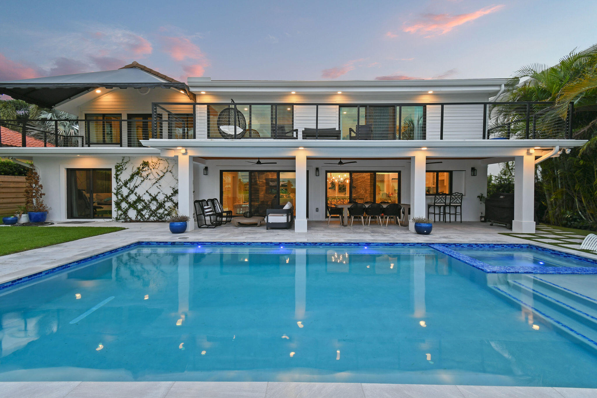 Set on one third of an acre with 90 feet of seawall just off the Intracoastal Waterway, this exceptional waterfront property sits at the end of a private, tree-canopied road. Designed for boating enthusiasts, the property offers deep water dockage for multiple vessels, no fixed bridges, a no wake zone, and both 20,000 lb and 10,000 lb boat lifts installed in 2021. The seawall was replaced in 2022. The professionally designed outdoor space features a new pool, spa, and decking, all positioned to enjoy wide water views. The existing four bedroom, three bath plus den pool home sits above the flood zone and includes over 4,000 square feet under air, including 324 square feet of air conditioned attic space. AC units were replaced in 2021 and the home is equipped with full impact glass. Ideally located on South Shore Drive with a picturesque oak lined approach surrounded by waterfront homes, the property offers convenient access to Juno Beach, shopping, dining, the mall, I-95 and more. A rare waterfront opportunity ready to enjoy.