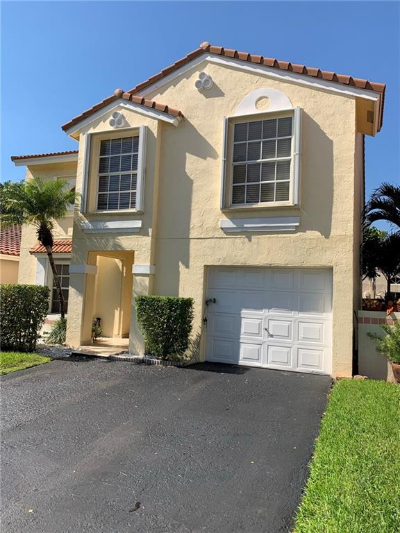 Very neat and well maintained single family home in Weston with one car garage and double driveway. Flexible floor plan allows ground floor to be used as either a great room with a formal dining room, or living room, dining area and family room. Breakfast bar in kitchen. Vaulted ceilings throughout. Master suite features large walk-in closet and his and her sinks in master bath. Second bathroom has a bath tub. Half bath downstairs for use by guests. Large roofed and screened 13x19 patio, perfect for parties, family functions or as a quiet retreat. Good sized privacy fenced backyard with room for swing set, or for dogs to run. Newer A/C system. 2010 roof. Beautiful community swimming pool. Quarterly HOA fee includes mowing of front yard. Top rated schools.