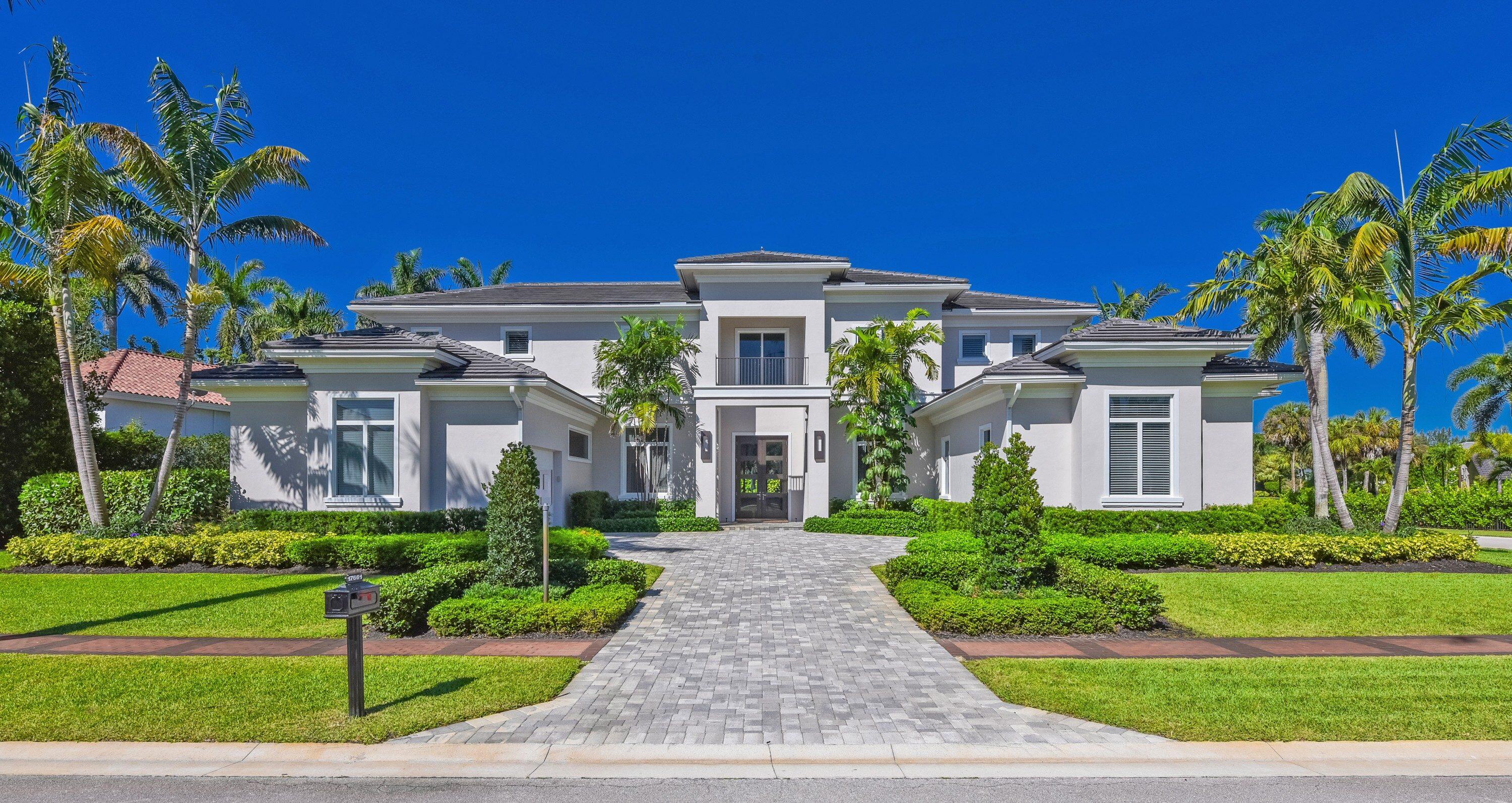 This magnificent approximately 6,400 sq. ft. estate home is located on a .44 acre home site with exceptional golf course view and features 5 spacious bedrooms, 6 full baths, 2 powder rooms, den/office, wet bar, elevator, open concept entertaining areas, plus a 2.5 car garage and a separate 1 car garage. The home is stylish and modern featuring an elegant and contemporary great room layout with soaring 26-foot coffered ceilings. The finest materials, finishes and craftsmanship showcase this home, including custom 24 x 48 white designer porcelain floors. The stunning, gourmet kitchen which opens to the great room features all high-end appliances, 3 ovens, microwave/convection oven, induction cooktop, four-foot galley sink workstation, 2 dishwashers, 100 bottle wine refrigerator and a   hidden, oversized pantry. The dramatic and elegant great room with soaring 26 foot ceilings includes a 100 inch linear fireplace and custom two story designer finished entertainment wall. The luxurious primary suite includes separate his and her bathrooms, and a "her" closet measuring over 200 sq. ft. finished with all high-end details. The large office/den is cozy and comfortable with an exquisite built in, wall to wall entertainment center. The second level features wide-planked hardwood floors, 4 additional and very large en-suite bedrooms all with oversized walk-in closets and a loft area overlooking the great room below. Outdoors, the lushly landscaped property features a dramatic resort style pool with sun shelf and spa, covered loggia with summer kitchen and dramatic golf course views.  ADDITIONAL FEATURES INCLUDE  Full House 48kw Generator   Control 4 Smart Home Automation System Gas Pool Heater  Finished Closets Throughout  Hurricane Impact Glass Doors and Windows  Thermador Steam Oven  Thermador Induction Cooktop  Thermador Wine Refrigerator  100" Linear Fireplace  Integrated Speaker System In Main Rooms And Primary Bedroom  4 Zone High Efficiency Trane AC's  Electrolux Washer/Dryer Package  Central Vacuum Throughout  Large Utility Room with Extra Storage  Resort Style Pool With Sun Shelf and Heated Spa  Gas Pool Heater Outdoor Lighting Outdoor Barbecue and Summer Kitchen