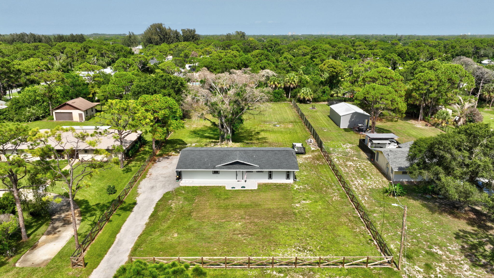 Escape the hustle and bustle and discover the space, privacy, and relaxed Florida lifestyle offered by this beautifully updated home in Indian River Estates. Situated on a sprawling lot with plenty of room to enjoy the outdoors, entertain, garden, or create your own backyard oasis, this 4-bedroom, 3-bath home was extensively remodeled inside and out in 2022 and features a NEW ROOF in 2022 and NEW SEPTIC SYSTEM in 2025! The spacious interior offers an inviting living area, a desirable split-bedroom floor plan, and an open kitchen beautifully appointed with marble countertops. The generous primary suite provides a private retreat, while the flexible layout offers plenty of room for family, guests, or a home office.  Outside, the expansive property creates the perfect backdrop for gatherings, recreation, and peaceful evenings surrounded by open space. Enjoy convenient access to the Indian River and beautiful Treasure Coast beaches, along with the waterfront shopping, dining, entertainment, and local charm of downtown Fort Pierce and the Jensen Beach waterfront. Offering the breathing room of country-style living while keeping you close to some of the area's most popular destinations, this move-in-ready home is ready to welcome its next owner!