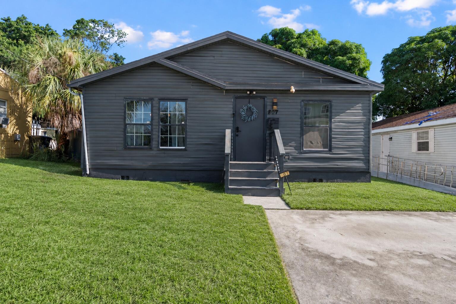 Welcome to 807 Grant St in West Palm Beach - a fantastic opportunity for homeowners and investors alike! This NON-HOA single-family home is fully Airbnb-ready and already operating as a profitable short-term rental with immediate income potential. Ideally located just minutes from Palm Beach Outlets, Rosemary Square/CityPlace, downtown West Palm Beach, Palm Beach Island, beaches, shopping, dining, and major highways. Enjoy a 10-minute walk to Northwood Village featuring popular restaurants, boutiques, and a soon-to-open grocery store. Perfect as a primary residence, vacation home, or income-producing investment offering flexibility, location, and South Florida charm!