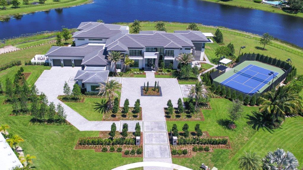 Just completed in 2017, this designer-appointed lakefront showplace overlooks the winding waters from a lush 2.5±-acre point site.  Glass walls connect the lake side of the house to the terraces and entertainment lanai served by a summer kitchen, next to the resort-inspired infinity pool with immersed spa and sun shelf.  A gazebo is by the fenced and lighted north-south tennis court.  Garages totaling five bays are by the parking court. Disclaimer: The information provided herein including but not limited to prices, measurements, square footages, lot sizes, calculations and statistics have been obtained and conveyed from third parties such as the applicable Multiple Listing Service, public records as well as other sources. All information including that produced by the Sellers or Listing Company are subject to errors, omissions or changes without notice and should be independently verified by any prospect for the purchase of a Property. The Sellers and Listing Company expressly disclaim any warranty or representation regarding all enclosed information. Prospects' use of any information herein is acknowledgement of this disclaimer and that Prospect shall perform their own due diligence. Prospects shall not rely on this information when entering into a contract for sale and purchase. Some affiliations may not be applicable to certain geographic areas. If your property is currently listed, please do not consider this a solicitation. In the event a Buyer defaults, no commission will be paid to either Broker on the Deposits retained by the Seller. "No Commissions Paid until Title Passes." Buyer pays title insurance, Florida documentary stamps, and all other closing costs. Taxes are based on vacant land only and subject to change. Copyright 2016 Listing Company. All Rights Reserved.

Buyer pays title insurance, Florida documentary stamps, and all other closing costs. Taxes are based on vacant land only and subject to change.