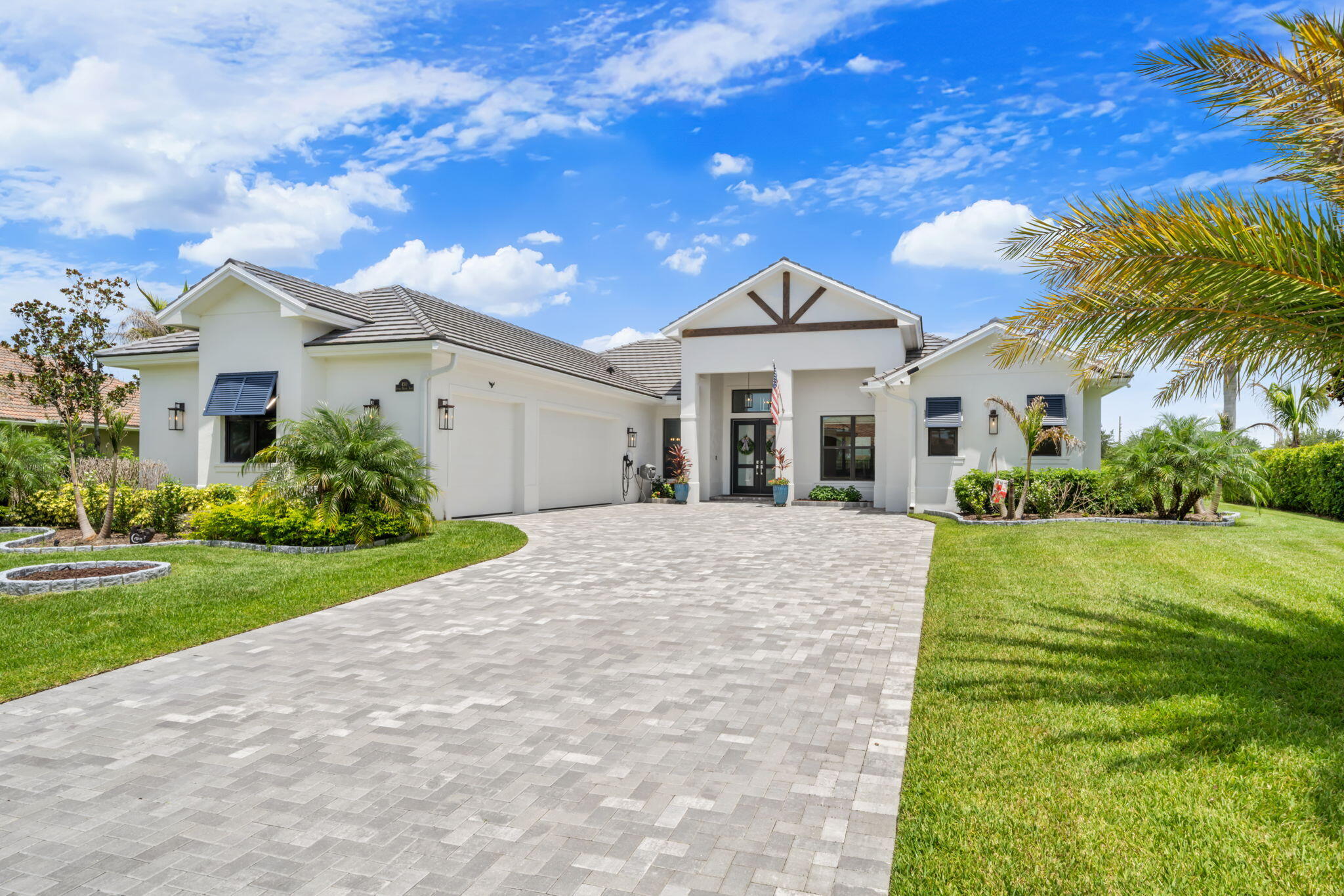 Exceptional custom home featuring luxury craftsmanship and designer finishes throughout. This stunning 3 bedroom with a Flex room/ 4th bedroom residence feature soaring 10' and 11' T&G ceilings, an open concept floor plan and premium Thermador appliances in the gourmet kitchen. The luxurious primary suite features a unique barista bar creating the perfect private retreat. Additional custom features and high-end finishes can be found throughout the home, blending elegance with everyday comfort. Step outside to enjoy the sparkling saltwater pool, spacious lanai, and outdoor living area ideal for entertaining or relaxing. * Shown by appointment only- Schedule your appointment today *
