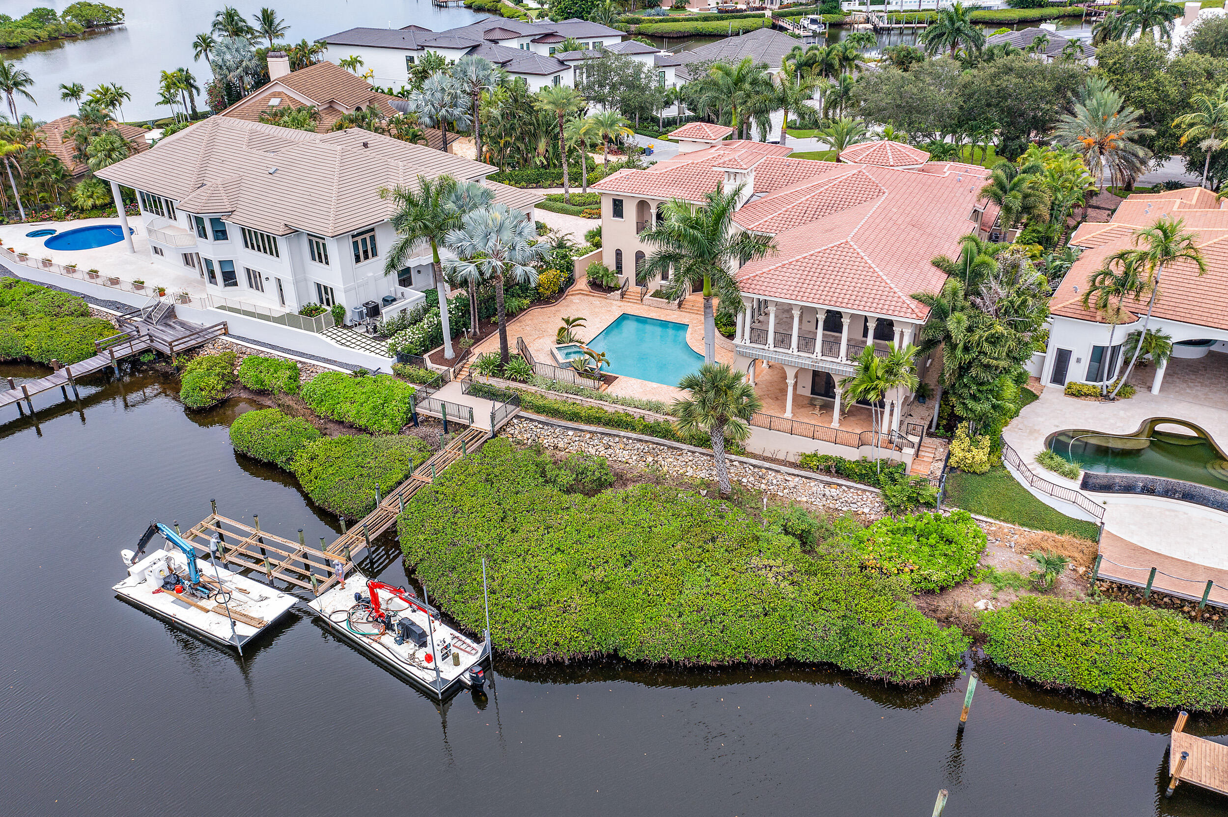 Waterfront Estate home with over 8,100 square feet of luxury living.  Currently undergoing a renovation including a new kitchen with high end appliances, new master bathroom, new dock, new laundry room and so much!  Renovations to be completed by November, 2021.    The home is located on a tree lined, cul-de-sac street in the highly desirable Admirals Cove.  Close to all the amenities and perfectly situated on over 100 feet of waterways with Intracoastal access.   The  home features 6 bedrooms, a theater room, impact windows, fresh paint, fine craftmanship and materials - a must see.