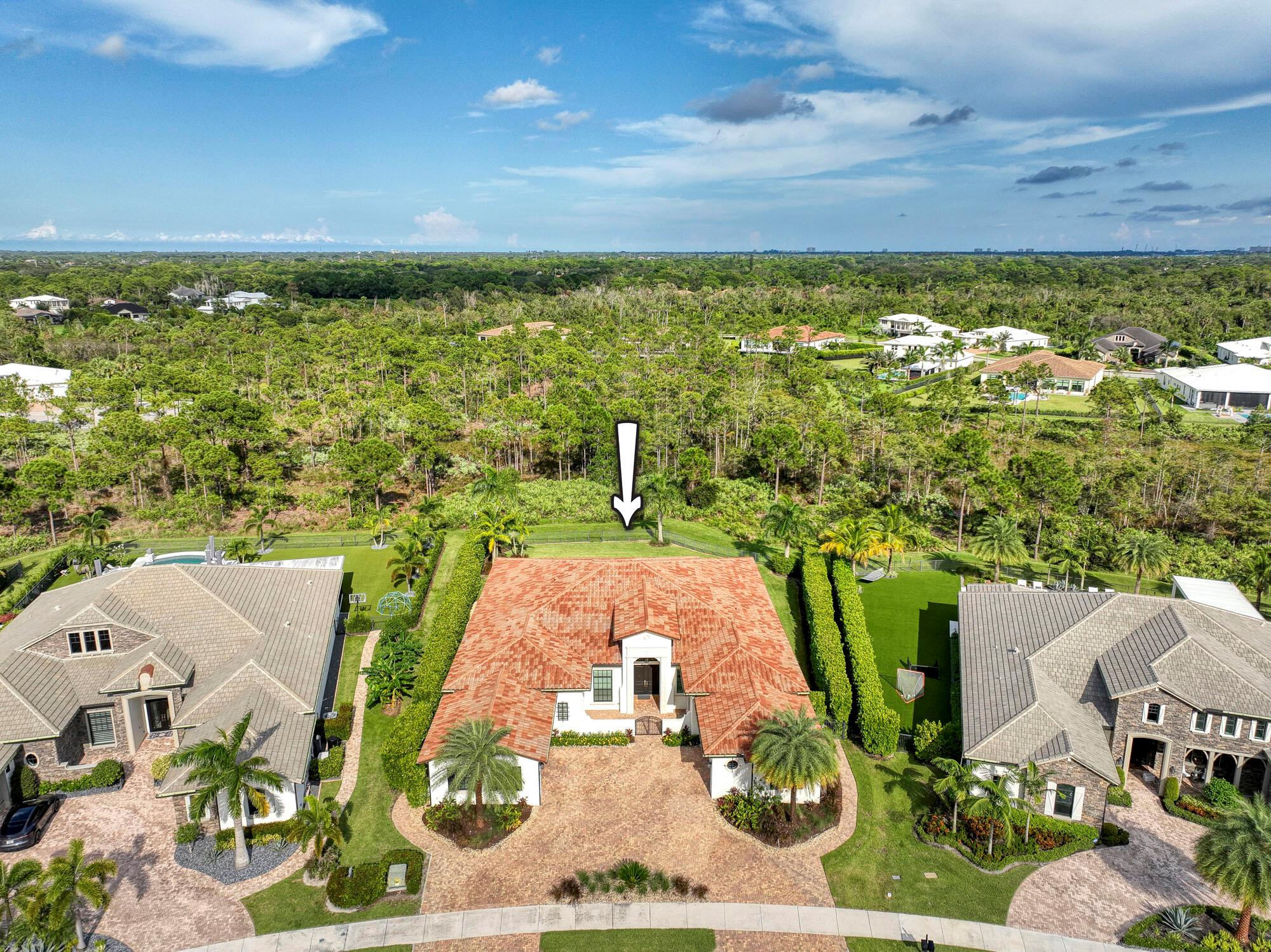 Welcome to the pinnacle of luxury living in the prestigious community of Prado! This breathtaking estate home, constructed in 2020 with meticulous attention to detail and countless upgrades, is sure to captivate your senses. Boasting 5 bedrooms, 5.5 bathrooms, with two 2-car garages, and an oversized Club Room used as guest suite, this residence exudes elegance and sophistication at every turn. Nestled on an upgraded lot overlooking a serene lake with a charming fountain and backing onto a picturesque wooded preserve, this home offers a rare blend of privacy and natural beauty. Stepping inside, you'll be greeted by a grand foyer adorned with soaring ceilings, setting the stage for the opulent interiors that await. The Club Room/suite, featuring custom closet build-outs with its adjacent 2-car garage complete with an additional Refrigerator/Freezer, offers a perfect space for relaxation and entertainment.