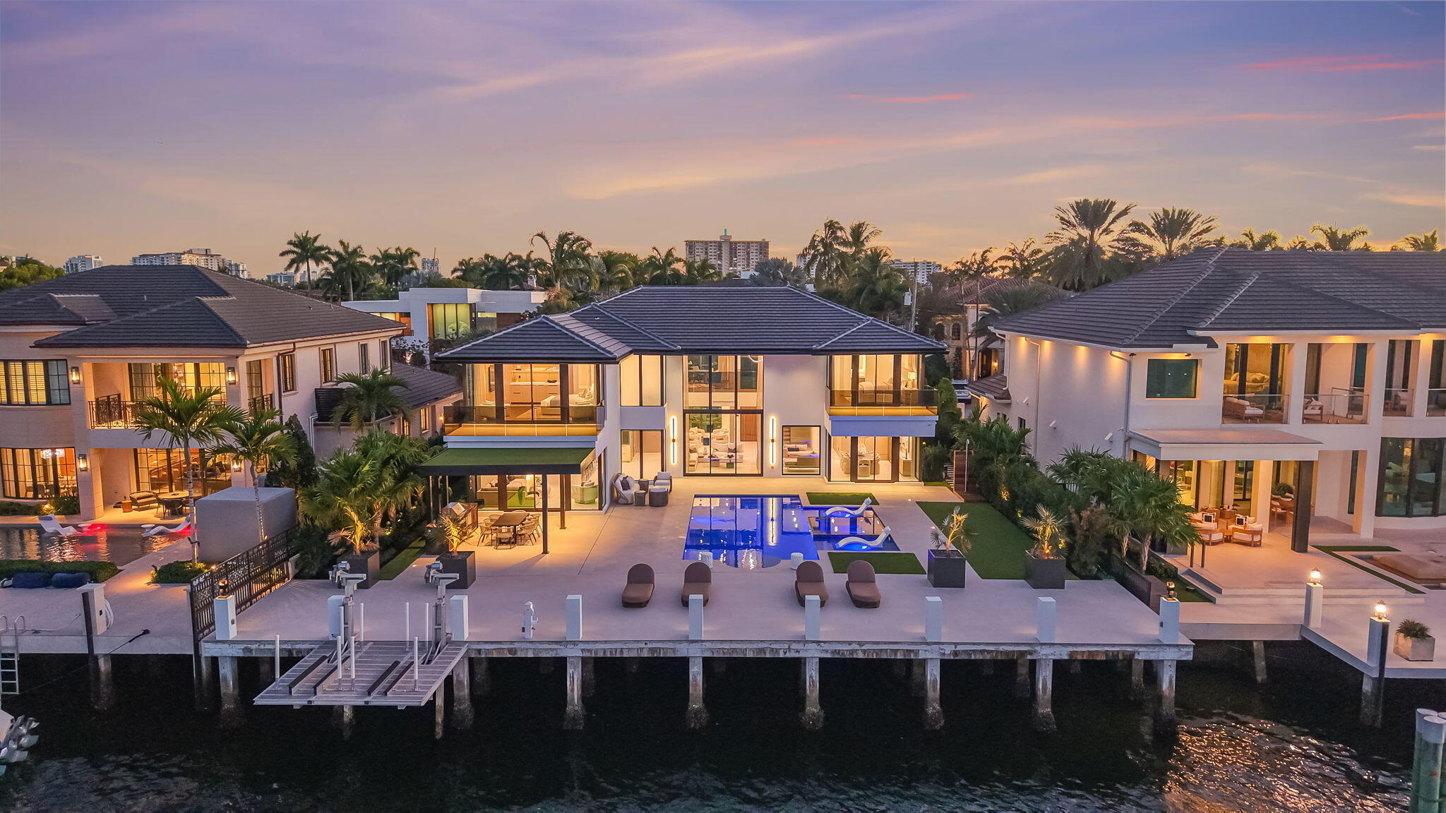 Superbly located on an $8mm plus direct intracoastal property that showcases views directly down the waterway! Enjoy 24/7 guard gated Seven Isles security & one of Las Olas most prestigious addresses. Surrounded by $20mm plus Estates & low-traffic serenity. Newly completed & never lived-in.  Interior design by Jaime Blomquist & custom construction/detailing by CKA. Open-concept entertaining areas with fabulous indoor-outdoor flow, one 1st level bedroom suite. Elevator, glass enclosed home office, entire Primary Suite wing separate dual baths & large closet, well-proportioned secondary suites. Resort inspired outdoor pool areas, summer kitchen & extended dock capture expansive intracoastal views. Too many custom features to list. Must be seen to be appreciated!