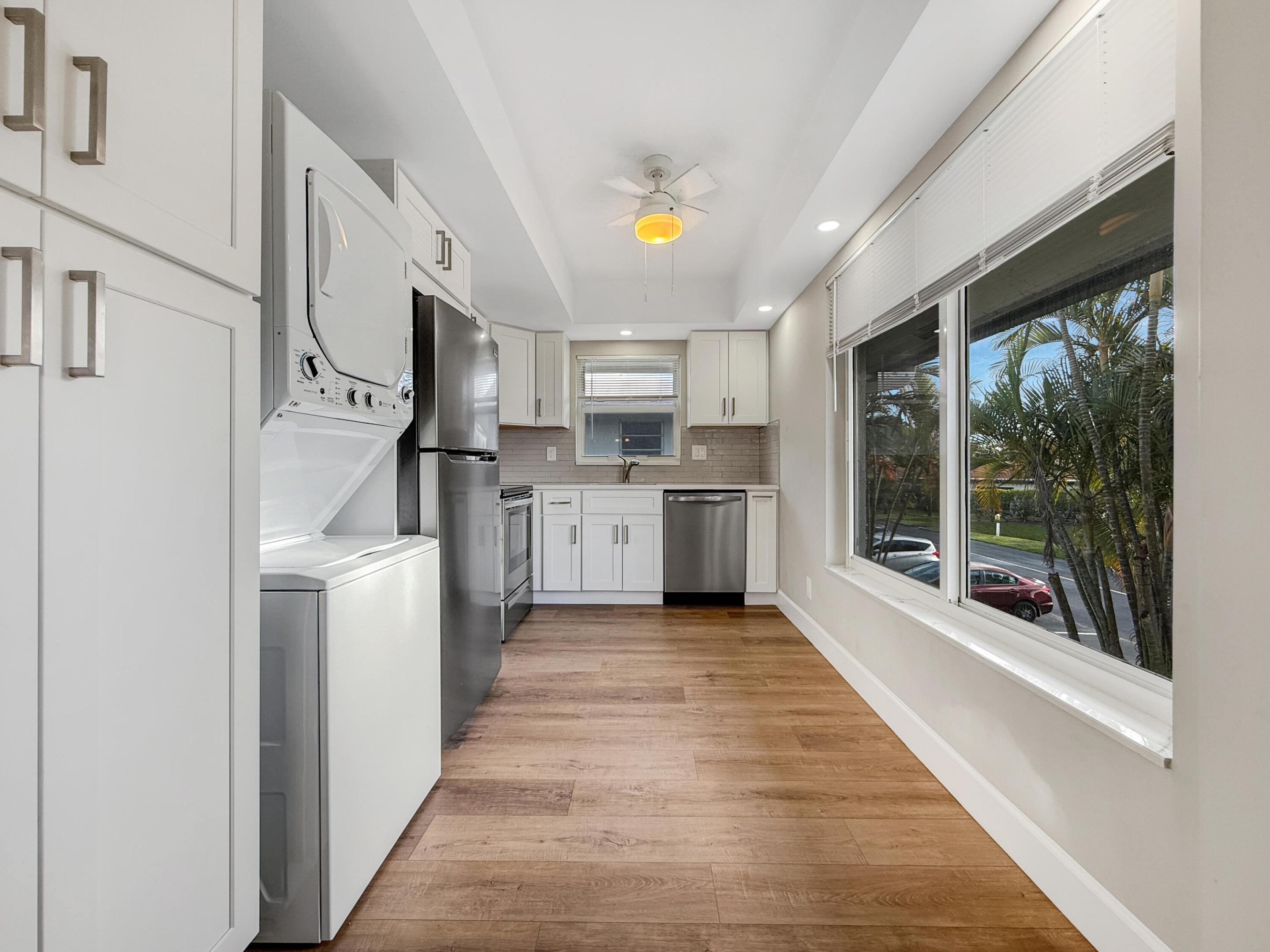 *** FULLY RENOVATED IN 2023 ***  IMPACT WINDOWS! NEW FLOORS! NEW APPLIANCES! EVERYTHING REPLACED IN 2023! ** ***  Great location with lots of lush & tropical views to enjoy. Internet & Cable, trash & water incl . Palm Greens is HIGHLY SOUGHT after. GREAT tennis prog. 9 HAR-TRU tennis cts & tennis center, Brand NEW Clubhouse just opened Feb 2026, 3 pools, Fitness Center, hot tub, billiard, pickle ball, clubs to join & friends to make! 5 mi to AWARD-WINNING Atlantic Ave super fun, unique w/great vibe, restaurants, boutiques, galleries, vibrant nightlife & 2 mi of GORGEOUS beaches.