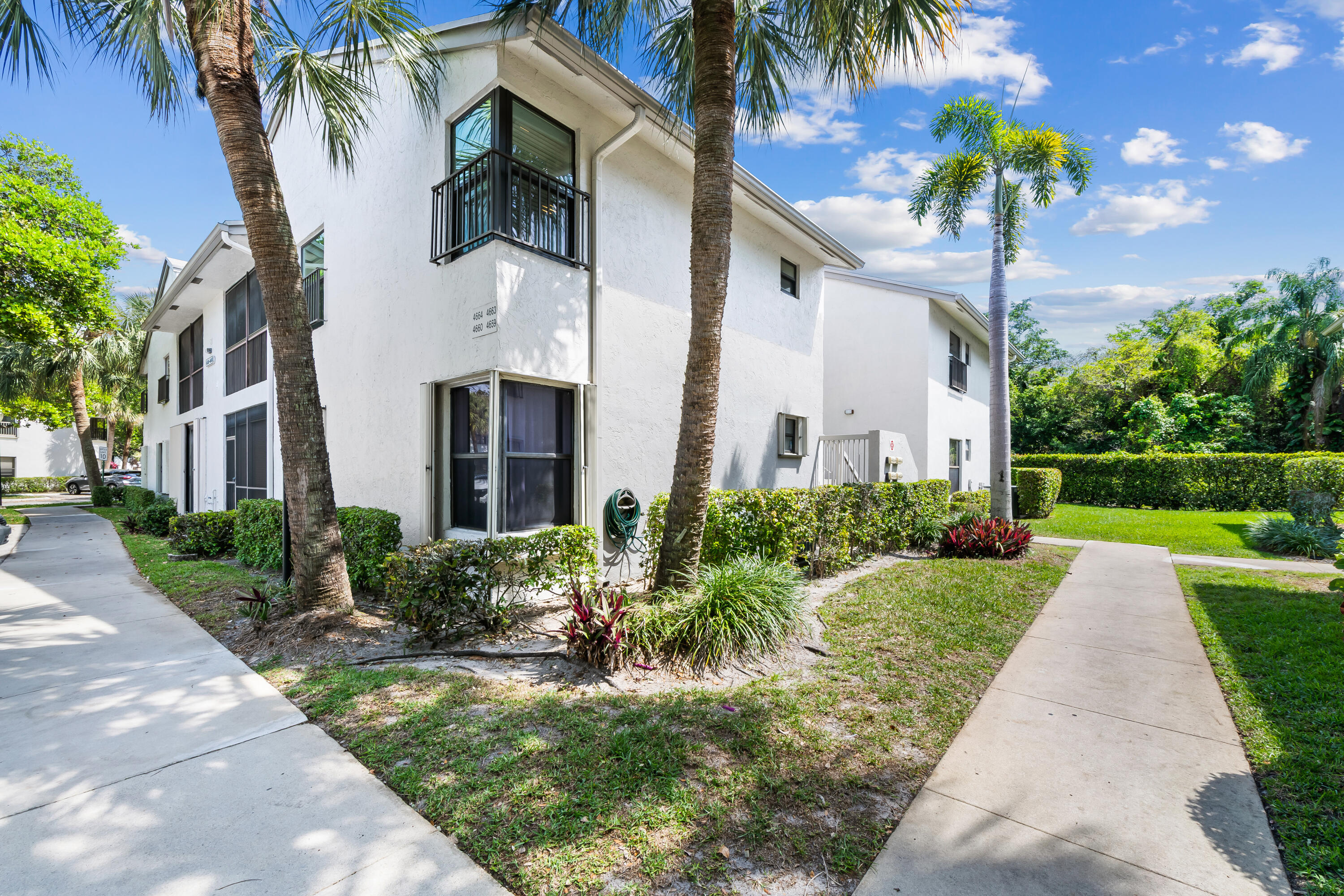 Beautifully updated 2nd-floor residence with 2020 roof, 2012 A/C, and 2018 WH. Freshly painted with new flooring throughout. Luxury kitchen w/ updated cabinetry, quartz countertops, and SS appliances. Split-bedroom layout with walk-in closet & updated baths, including a primary suite with Hansgrohe shower and brand-new double vanity. Features include IMPACT windows & front door, recessed lighting, full-size washer/dryer, pull-down attic w/ ample storage & enclosed screened patio. Enjoy resort-style amenities:pools, fitness center, clubhouse, tennis & more. Minutes to The Promenade at Coconut Creek. Maintenance incl. cable, water, sewer, landscaping, exterior insurance & amenities. Reserved parking + guest. Pets OK up to 25 pounds. No leasing first 3 yrs. Trucks OK, no commercial vehicles.