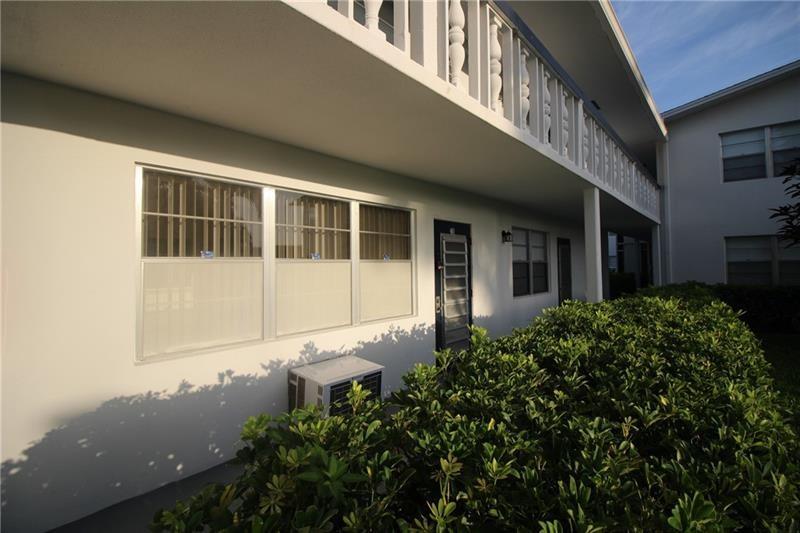 55+ Community 1st Floor ground unit situated in the center of the building door face north. 2 window unit newer AC located in living room and bedroom. screen back porch area. Units would be consider retro. most items in the home are original. offering new owner the option to do his or her own renovation if they chose. close walk to tennis  and pool . Clean, Safe and functional home.