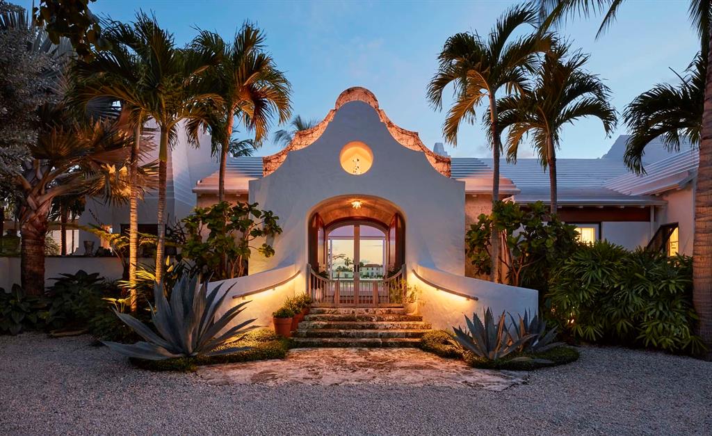 Authentic Bermudian-style house with 232' of rare south facing Intracoastal frontage and golf course views. Built for entertaining, the house won the 2017 Schuler Award from the Preservation Foundation for outstanding new architecture, as well as an AIA award for excellence in design. The large master suite incorporates a dressing room and two spa quality bathrooms as well as a sitting room and fully equipped gym. The property features a whole house generator, garage space for five cars, full smart home technology, a water purification system, retractable glass walls, lush mature landscaping and numerous other highly detailed architectural touches that make this spectacular home truly unique.