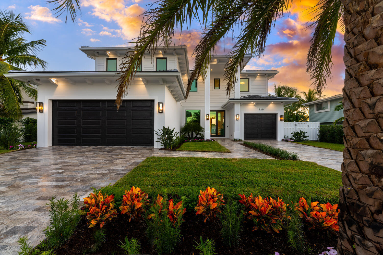 Spectacular Resort style living in this one of a kind waterfront estate in the Village of North Palm Beach. Built in 2022. No detail was spared in the custom design and quality workmanship. This coastal home is professionally appointed with designer finishes and superior materials. With southern exposure, you will enjoy sunrise and sunset views from the pool, spa, back yard and expansive lanai. Located only 5 miles from the blue waters of Palm Beach inlet, you are only minutes to some of the best fishing in the world. With easy access to Palm Beach International airport, upscale dining establishments, and beautiful beaches, the Village of North Palm Beach is one of the top communities in Northern Palm Beach County. Some of the highlights include: 5 bedroom 4.5, bath, office, game room, and 3 car garage, Total Sq. Ft. 6,742, Living Sq. Ft. 4,725, Lot measures 130 x 80, .25 acres, CBS construction, 80' of water frontage, Deep wide canal with ocean access, New 60' dock with composite decking, 20K boat lift, new seawall cap and retaining wall, 2 storage locations for kayaks or paddleboards, Heated salt system pool & spa with double blue quartzscape finish and white marble sun deck, professional landscaping front and back yard, Silver travertine driveways and walkways, Impressive exterior foyer leads to double door entry,
beautiful views of the water and docks, designer finishes, All closets fully built out, Custom ceilings throughout, Custom lighting throughout, Arched entries, Elevator, Natural gas, Engineered oak wood flooring, Kohler fixtures throughout all bathrooms, LED lighting, 12' ceilings, Coffered ceilings, Tankless water heater,
Icynene attic insulation, Gypcrete soundproof floor on second floor, 2 a/c units, Pad and gas hook up for full house generator, Pool, dock, and water views from first and second floors.
First floor features a bright family room with wall to wall 10 ft sliders opening to the oversized lanai, and back yard area. Family room has an EcoSmart fireplace and an impressive staircase with solid oak tread, painted risers and wrought iron railing, The bar area has 2 beverage coolers/wine coolers with temperature control, 3 refrigerator drawers, ice maker, sink, cabinetry with glass door accents and stamped porcelain counter tops. The designer gourmet kitchen has paneled SubZero refrigerator and freezer, 5 burner LaCanche stove with griddle, pot filler, custom vented hood, double oven, shaker cabinetry, and stamped porcelain counter tops. The kitchen island has plenty of room for seating, Shaw's porcelain farmhouse sink, 2 Viking dishwashers, 2 pull out trash cabinets and Perrin & Rowe fixtures. There is an oversized pantry with oak shelving, storage drawers and cabinetry. The first floor also has an office with double barn door entry, built in cabinetry and shelving, 1st floor laundry room and mud room, additional laundry room on 2nd floor, 1st floor guest bedroom (1) has reach in closet and pendant lighting, 1st floor powder room has single vanity, cabana bath has single vanity, shower with frameless glass doors, marble flooring and frosted door with access to the back yard area, summer kitchen has cooler, ice maker, sink, and grill. Master bedroom (2nd floor) has sliders to the wrap around balcony, waterfront views, and large walk-in his and hers closets. Master bath has double vanity, custom mirror, freestanding tub and steam shower. 2nd floor guest bedroom (2) has walk-in -closet and custom lighting. 2nd floor game room / bedroom room (3) has expansive views of the water, 2nd floor Guest bedroom 4 has sliders to the wrap around balcony en-suite bath with single vanity and shower. 5th bedroom/optional gym- no closet at this time. 2nd floor guest bath has single vanity and shower Game room has an attached guest bath with single vanity and shower. The wrap around balcony has porcelain tile flooring, tongue & groove ceilings, and an expansive view of the water. This home is perfectly situated in the heart of North Palm Beach. Minutes to the new North Palm Beach Country Club featuring the newly redesigned Jack Nicklaus Signature golf course, pool, tennis, and fine dining