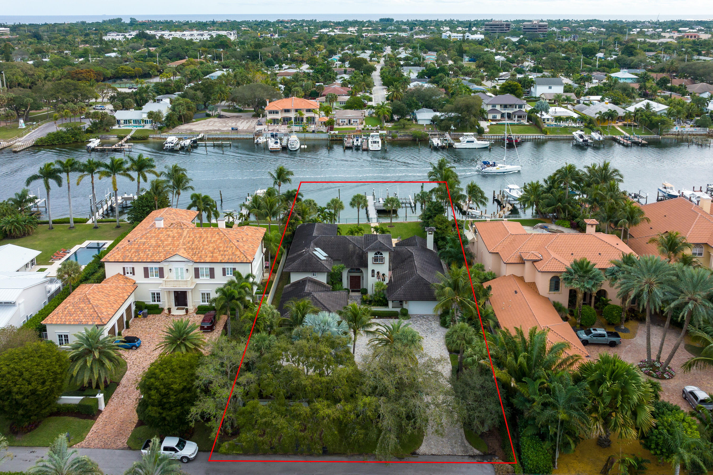 Rarely available 0.65 acre lot with over 100 ft. of water frontage. Fully fenced and gated. County taxes. 75 ft. boat slip and 2 additional slips, one of which is a 5,000 lb. double jet ski lift, other is a 16,000 lb. boat lift. Renovated in 2008 featuring 4 bedrooms, 4.5 baths, 4 car garage, over 4,700 sq.ft. of living space & 6,478 sq.ft. total. Pool and spa, outdoor kitchen & full outdoor bar and grill, movie theater, gym, butler's kitchen/pantry and more.