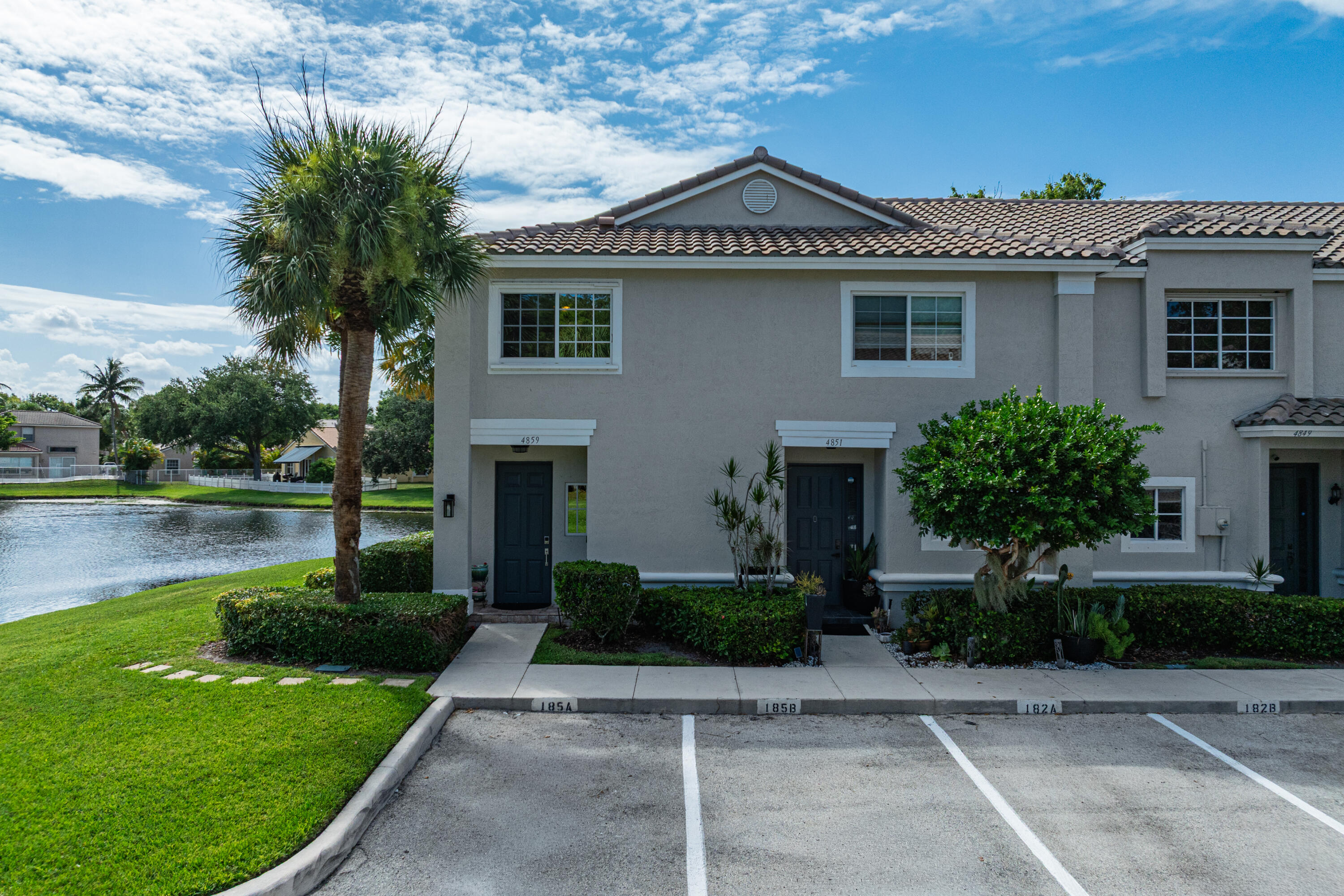 Rarely available, 2-story corner lot residence in the highly desirable gated enclave of Victoria Isles. This private, sun-drenched property offers sweeping, unobstructed lake views. Rest easy with hurricane protection throughout—including the front door—allowing you to enjoy peaceful water views with total peace of mind. The interior features beautifully updated kitchen and bathrooms. Energy-efficient tinted windows keep the home cool & utility bills low. Located just minutes from premier shopping, dining, and expressways, this vibrant community offers a walkable lifestyle. HOA fees include: 24-hour gated security, ADT alarm monitoring, lawn maintenance and access to a beautiful clubhouse and resort-style pool. This is one you don't want to miss!  Book your private showing today! Great sought after community and rarely available 3 BR, Corner & Water front and side residence.