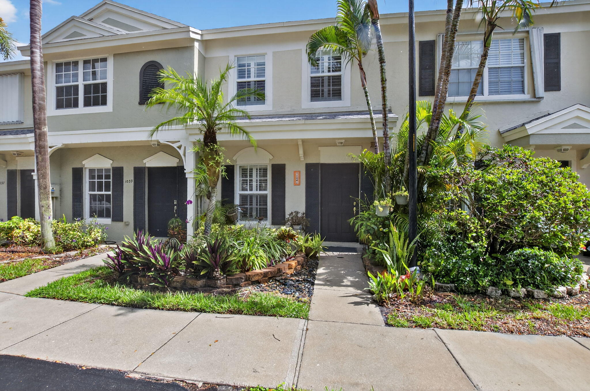 Available as a furnished short-term rental, this charming 2-bedroom, 2.5-bathroom townhouse offers the perfect blend of comfort, convenience, and coastal living. The bright and inviting living area provides an ideal space for relaxing or entertaining, while the well-appointed kitchen features ceramic tile countertops and stainless-steel appliances.  Upstairs, you'll find a spacious primary suite and a versatile guest bedroom/home office, each with its own private bathroom. Start your day with coffee in the covered sunroom, relax outdoors on the patio, take a refreshing swim in the community pool, or stroll over to the Intracoastal Waterway and enjoy watching the boats cruise by.  Ideally located just minutes from the beach and vibrant downtown, this townhome offers easy access to it all! Available off-season for $3,000/mo and seasonal for $5,000/mo.