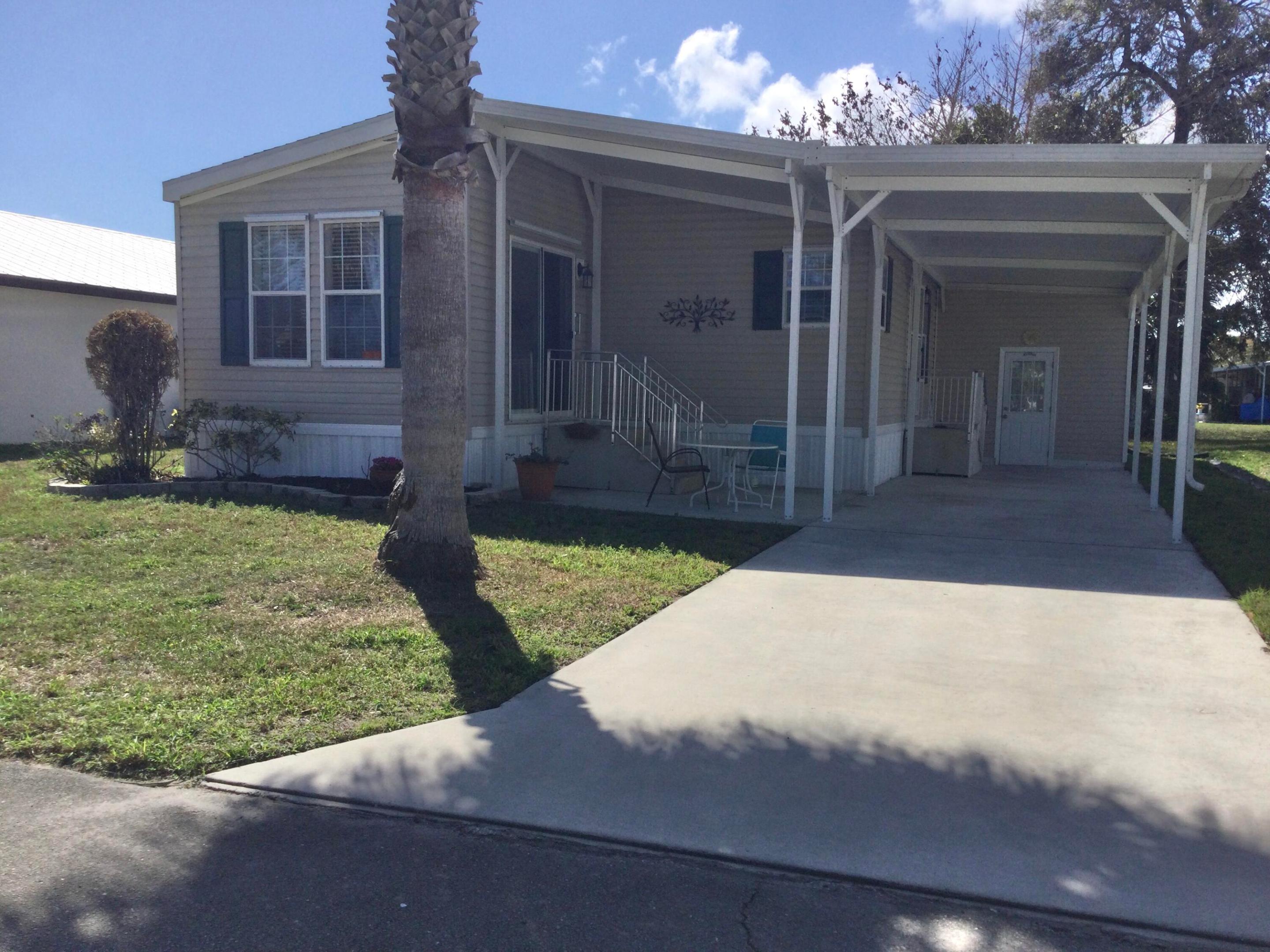Meticulously maintained home in the much sought after Spanish Lakes Community.  This is one of the newer manufactured homes in the community featuring indoor laundry, 2022 roof and 2019 ac unit.  Home is nicely situated on the canal.  Land lease covers all amenities, taxes, lawn care and trash removal.  Amenities include golf, 2 pools, shuffleboard, pickleball, bocce, horseshoes, tennis, billiards, ping pong, community room, party room, game room, library, fitness center and dog park.  Spanish Lakes is a 55+ community.  Future residents must be approved by Spanish Lakes.  Call for application. Mobile home license required to show and sell.  Mobile home license # BH/1130558/1.  Home is turnkey.  Items that do not convey include Queen bed, two brown reclining chairs, rocking chair, stereo cabinet and miscellaneous personal belongs.