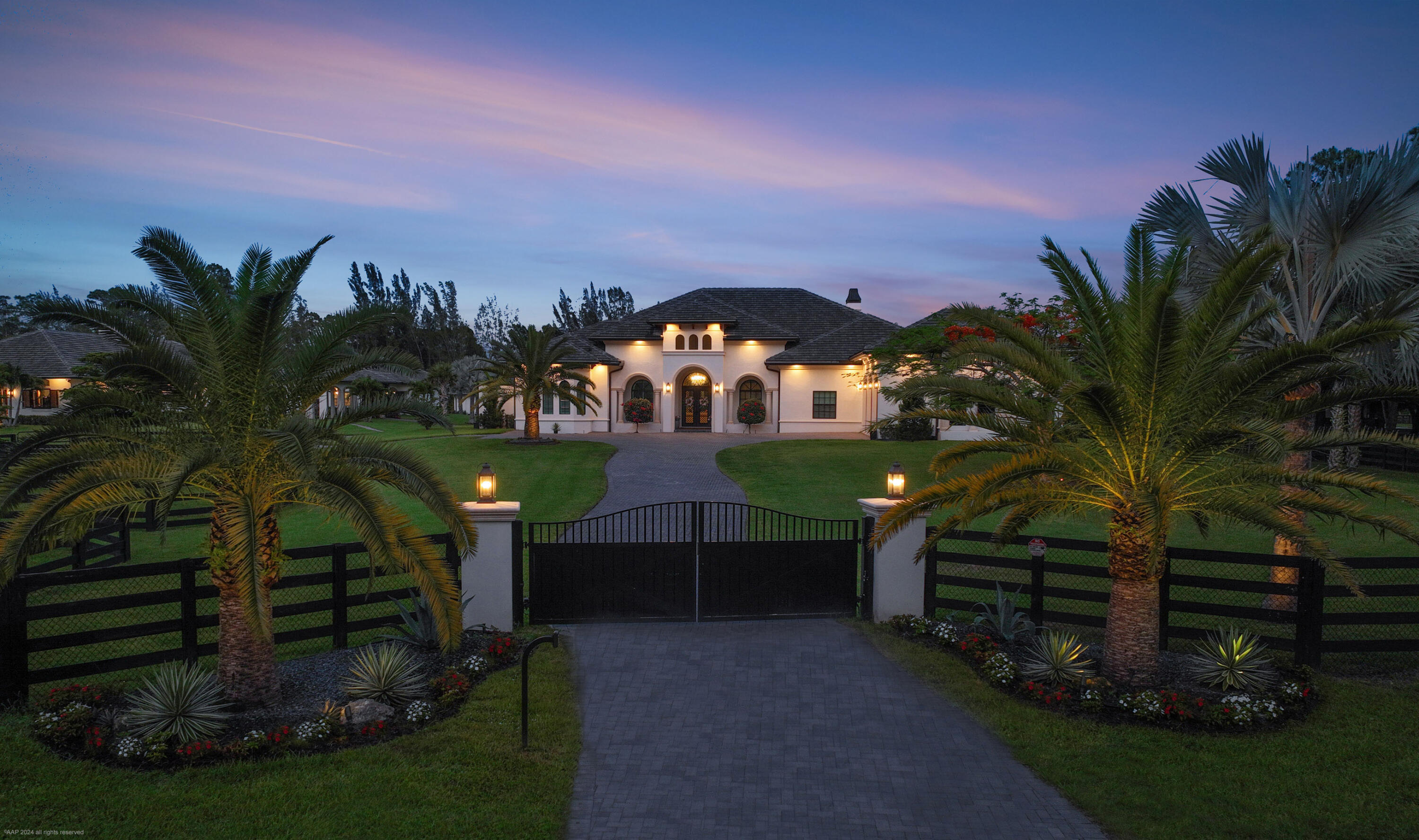 This stunning 5-acre farm in Fox Trail was built in 2022 with no expense spared. The property was expertly designed and sited on an east-west axis, an optimal layout to take advantage of tropical breezes.

The main house features a three-way split floor plan with 4 bedrooms, an office and 4 bathrooms. There are Italian six foot plank porcelain floors throughout, two fireplaces, a chef's kitchen equipped with Wolf and Sub-Zero appliances, Italian Verona marble countertops and backsplash, luxurious polished nickel faucets, pot filler and accents, butler's pantry, a light-filled laundry room with Chicago brick floors and a custom made barn door that will make doing laundry effortless.

The spacious master suite has large stacking sliding doors that lead to the pool area, but also offer privacy with automatic Zebra blinds. The his and hers large walk-in closets make organization a snap with intuitively placed built-in shelving. 

A fantastic indoor/outdoor flow makes entertaining a pleasure.

Relax and watch from a distance in the luxurious screened-in pool area overlooking the paddocks and arena. Unwind in the salt water pool with sun-shelf between the two copper fire bowls or hang out with friends in the large outdoor lanai while listening to your favorite tune on the Sonos/Bose sound system. The lanai boasts a full outdoor kitchen. 

The 3-car garage offers extra tall doors with room should you want to add lifts to fit all your car storage needs. Two of the bays are extra deep to accommodate an RV or boat.

The equestrian facilities include a 7-stall center-aisle main barn with fly system, fans and security cameras in each stall. There are two additional stalls equipped with fans, cameras and fly spray system in the storage building. That's a total of nine well-appointed, top-notch stalls.

There are three wash/grooming stalls with hot and cold filtered water, a gorgeous tack-room, laundry room, feed room and a separate air conditioned storage room for hay/shavings with a motorized roll up door for convenient deliveries. The barn lounge is a great spot to relax after a long ride and the full bathroom with glassed in shower offers comfort and privacy. This property is a horse-owner's dream.

The professionally decorated two bedroom, two full bathroom guesthouse is connected to the barn by a covered breezeway. In this charming guesthouse you will find a full kitchen, separate laundry room and an outdoor covered patio. In addition, there is a full RV hookup. 

Your horses will have plenty of room to exercise between the 10 grass paddocks, 60' round pen and 100 x 200 outdoor arena with a large mirror and GGT footing. As if that's not enough, a gate at the back of the property leads you straight out to Fox Trails fantastic trail system.

This fully-fenced property offers everything you need for an exceptional equestrian lifestyle. Two separate gated entrances keep the barn and main house traffic independent. And with 30 cameras plus security lights throughout you will be able to keep an eye on every corner of the property from anywhere in the world.

This farm is completely safe during storm season with impact windows throughout and a whole farm generator so that everything will continue to operate smoothly even during a power outage. A 500-gallon buried propane tank services the generator, gas appliances and the tankless water heaters.

Fox Trail now allows the building of covered arenas, making this the perfect place to ride year-round. This equestrian haven is just 15 minutes from Wellington's horse shows. Act quickly to make it yours!

DISCLAIMER: All information provided to you regarding this Property by Realtor and her associates has been obtained from third parties such as the Multiple Listing Service, public records and other sources. All Buyers should independently verify all information provided regarding this Property. The Sellers, Realtor and Broker make no representation as to the accuracy of this information. All Buyers should perform their own independent due diligence regarding this Property before executing a Contract for Sale and Purchase for this Property.