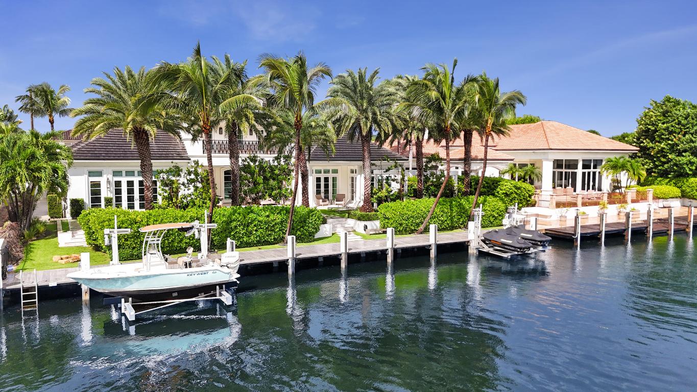 Your Lighthouse Dream Home awaits! This stunning 5 bedroom, 4.5 bathroom waterfront home, completed in 2017, offers the very best of luxury living directly on the Intracoastal and truly leaves nothing to be desired. With breathtaking water views from nearly every room, it features two club rooms with full bars, a first-floor master suite with an office, as well as four luxurious bedrooms and a spacious laundry room. The property boasts 100 feet of Intracoastal frontage, a pool, spa, two boat lifts, and is set on a 14,000 sqft lot, just minutes from the Hillsboro Inlet. The chef's kitchen is a true highlight, with top-of-the-line, stainless steel appliances, sleek European cabinetry, and a spacious island perfect for entertaining. The primary suite is a private retreat with stunning water views, and a luxurious, light-filled, en-suite bath offering dual vanities, a soaking tub, and a rainfall shower. Two walk-in closets as well as a morning bar and spacious office suite with sweeping views of the backyard and Intracoastal waterway complete this tranquil and luxurious primary suite. Next to the stunning open concept living space, the sun-filled clubroom opens up to the covered patio and invites to a round of pool or a drink at the elegant bar. On the second floor, this estate home boasts another club room area and a second bar area, two full bedroom suites with oversized balcony and gorgeous water views, as well as a third bedroom. The timeless design of this home is complemented by an outdoor area second to none. The large covered patio featuring a beautiful, wood burning fireplace and a remote-controlled screen enclosure offers the ideal space for outdoor entertaining. Additional seating in the perfectly manicured backyard as well as a chef-inspired summer kitchen invite to beautiful dinners under the stars, while two boat lifts provide easy access to the waters of the Intracoastal. An oversized three-car garage with additional storage offers ample space for all of life's funnest toys. Beautiful parks, two marinas, restaurants, two tennis clubs, playgrounds, sports fields and many other amenities are conveniently located directly in beautiful Lighthouse Point. The city also has its own police force as well as fire department and library. This is truly Florida living at its very finest!