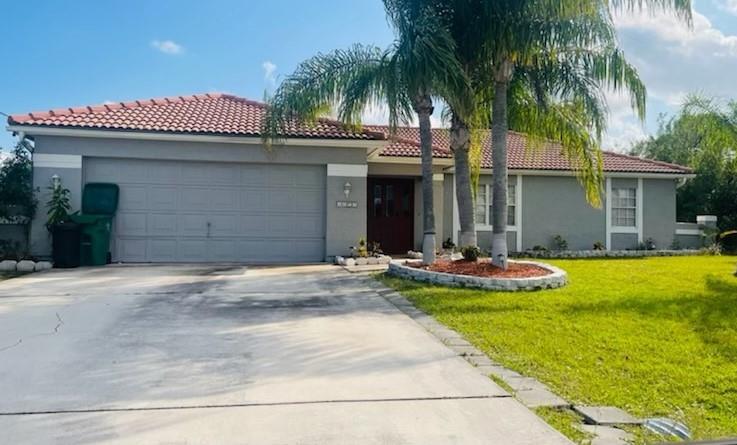 this Beautiful 3/2 house, has been completely renovated with new kitchen cabinets, granite countertops, and new appliances, new tiles thru out, new paint, master bathroom have been totally renovated, it is a must see!