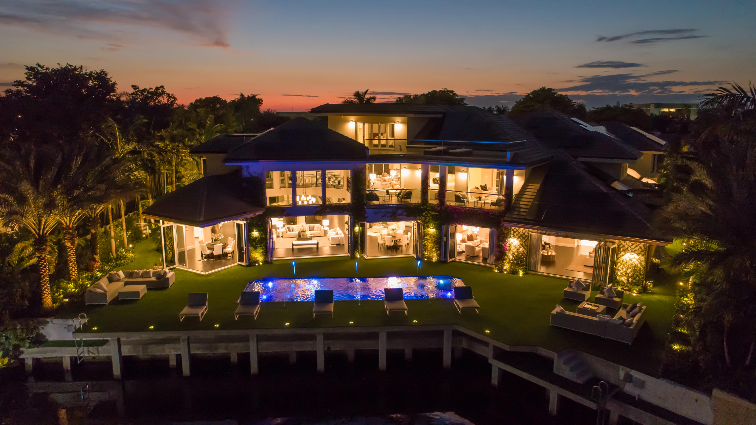 Reimagined Sanctuary Deepwater Estate-like Mansion sited on 105+/-  feet of water frontage with long water views has been re-designed and expanded with a warm modern flair.  A fabulous opportunity to acquire an exquisitely renovated estate (2018) on a prime Sanctuary waterfront setting with expansive motor court entry.  High ceilings and vast open spaces and retractable doors set the tone for indoor/outdoor entertaining.  Resort – style patio with carefree turf patio, brand new pool with LED lighting and fountain feature. New Dock for your water vessel. Shown by appointment only. DISCLAIMER: Information published or otherwise provided by the listing company and its representatives including but not limited to prices, measurements, square footages, lot sizes, calculations and statistics are deemed reliable but are not guaranteed and are subject to errors, omissions or changes without notice. All such information should be independently verified by any prospective purchaser or seller. Parties should perform their own due diligence to verify such information prior to a sale or listing. Listing company expressly disclaims any warranty or representation regarding such information. Prices published are either list price, sold price, and/or last asking price. The listing company participates in the Multiple Listing Service and IDX. The properties published as listed and sold are not necessarily exclusive to listing company and may be listed or have sold with other members of the Multiple Listing Service. Transactions where listing company represented both buyers and sellers are calculated as two sales. The listing company's marketplace is all of the following: Vero Beach, Town of Orchid, Indian River Shores, Town of Palm Beach, West Palm Beach, Manalapan Beach, Point Manalapan, Hypoluxo Island, Ocean Ridge, Gulf Stream, Delray Beach, Highland Beach, Boca Raton, East Deerfield Beach, Hillsboro Beach, Hillsboro Shores, East Pompano Beach, Lighthouse Point, Sea Ranch Lakes and Fort Lauderdale. Cooperating brokers are advised that in the event of a Buyer default, no commission will be paid to a cooperating Broker on the Deposits retained by the Seller. No commissions are paid to any cooperating broker until title passes or upon actual commencement of a lease. Some affiliations may not be applicable to certain geographic areas. If your property is currently listed with another broker, please disregard any solicitation for services. Copyright 2021 listing company All Rights Reserved.