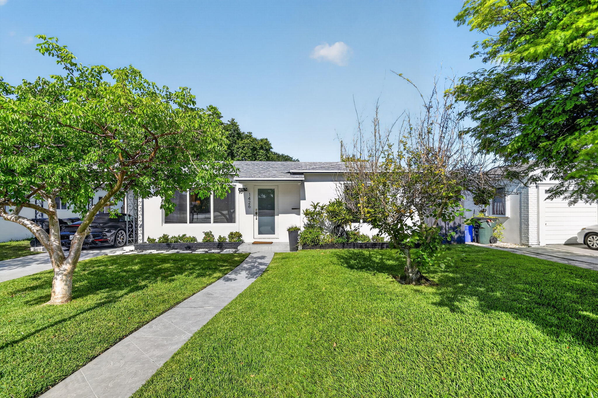 Welcome to this charming single-story residence Great neighborhood, charming single story home! Bright and cheerful inside with a large fenced backyard spacious enough to add a  pool, outdoor kitchen or tiki hut. Renovated interior including impact windows, new air conditioner, on demand water heater and new appliances. Close to all the fun and eclectic shops and restaurants in downtown Lake Worth. Bike to the beach! Don't miss this cute house!  Furniture is negotiable.