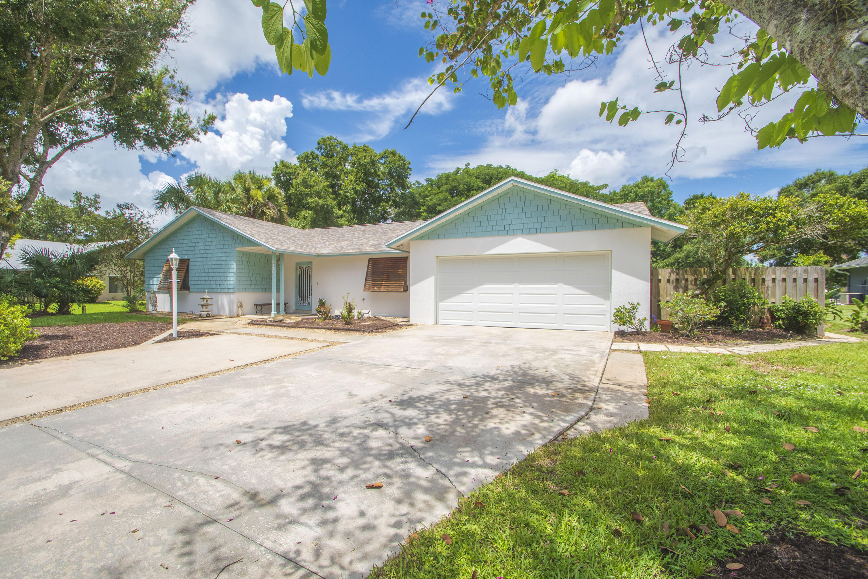 Classic pool home nestled into a lovely 1/2 area lot. The important updates include new roof 2026, AC unit 2025, re-piped 2025, W/H newer. Solar panels heat the pool and water heater. The home offers plenty of space with a living room and family room. A beautiful beamed vaulted ceiling is the family room feature! Great location is perfect for commuters with easy access to 95. Yet only 20 mins to the pristine beaches of the Treasure Coast. While the community was recorded as an HOA in 1978, boats & other vehicles have been welcomed here. Don't delay this pool home is seeking new loving owners.