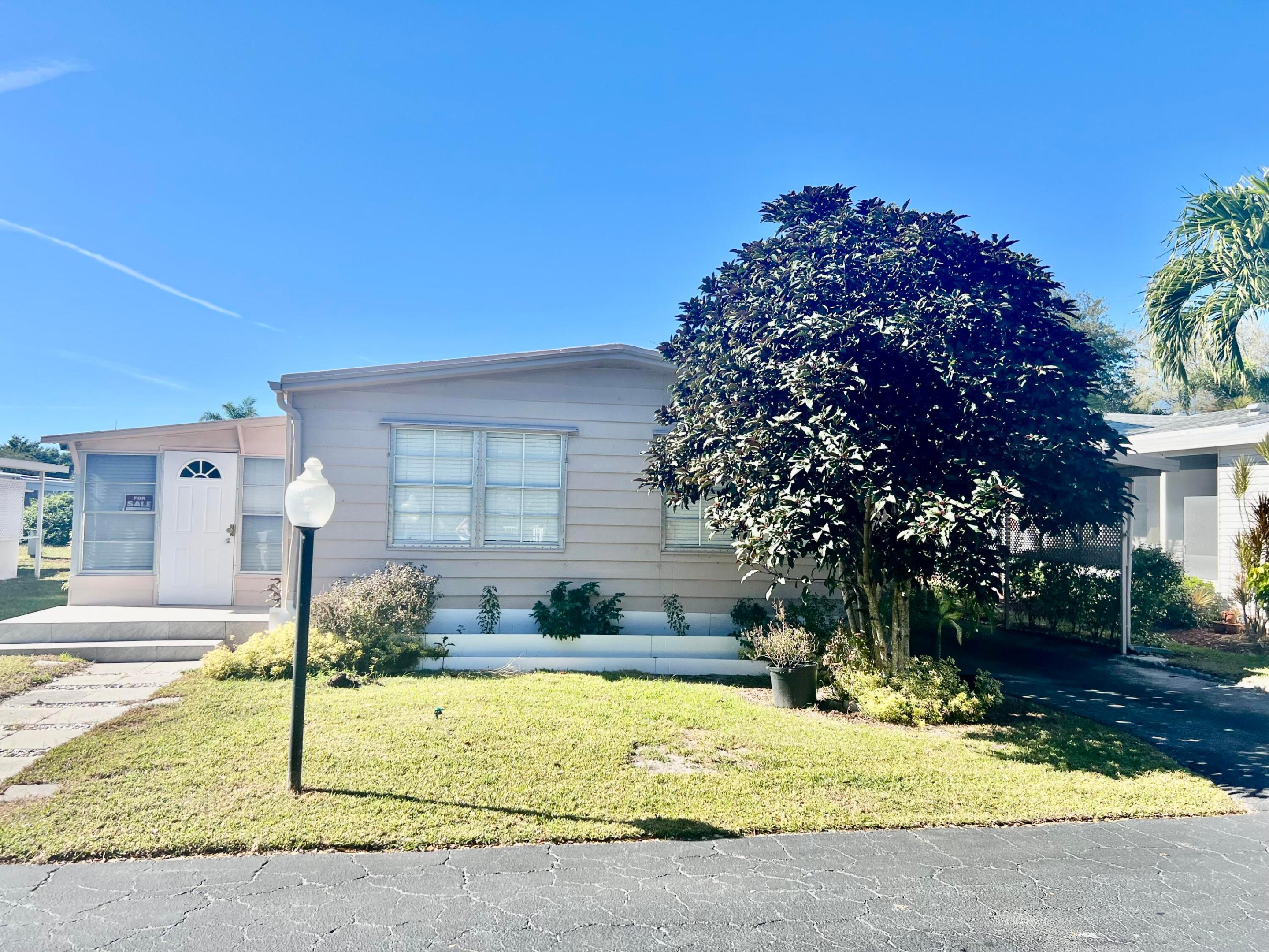LOCATION, LOCATION, LOCATION! DON'T MISS THIS OPPORTUNITY. THIS IS A 2/2 LOCATED IN A 55+ GATED COMMUNITY. TOTALLY REMODELED: NEW FLOOR, NEW WALLS, NEW ELECTRICAL SYSTEM, NEW A/C. THE KITCHEN IS OPEN THROUGH WITH A LARGE GRANITE COUNTER TOP THAT CAN BE SEATED 12 PEOPLE, NEW STAINLESS STEEL APPLIANCES. CUSTOMER'S MADE CABINETS THROUGHOUT THE HOUSE. THE LOT RENTAL IS $1,160.00 PER MONTH WHICH INCLUDES TRASH REMOVAL, WATER, LANDSCAPING,TAXES AND PEST CONTROL. THE CLUB HOUSE OFFERS LOTS OF ACTIVITIES AND CLOSED TO ALL MAJOR HIGHWAYS, HOSPITALS, SHOPPING, AND RESTAURANTS. AS AN INCENTIVE SELLER IS OFFERING TO PAY THREE(3) MONTHS OF LOT RENTAL.